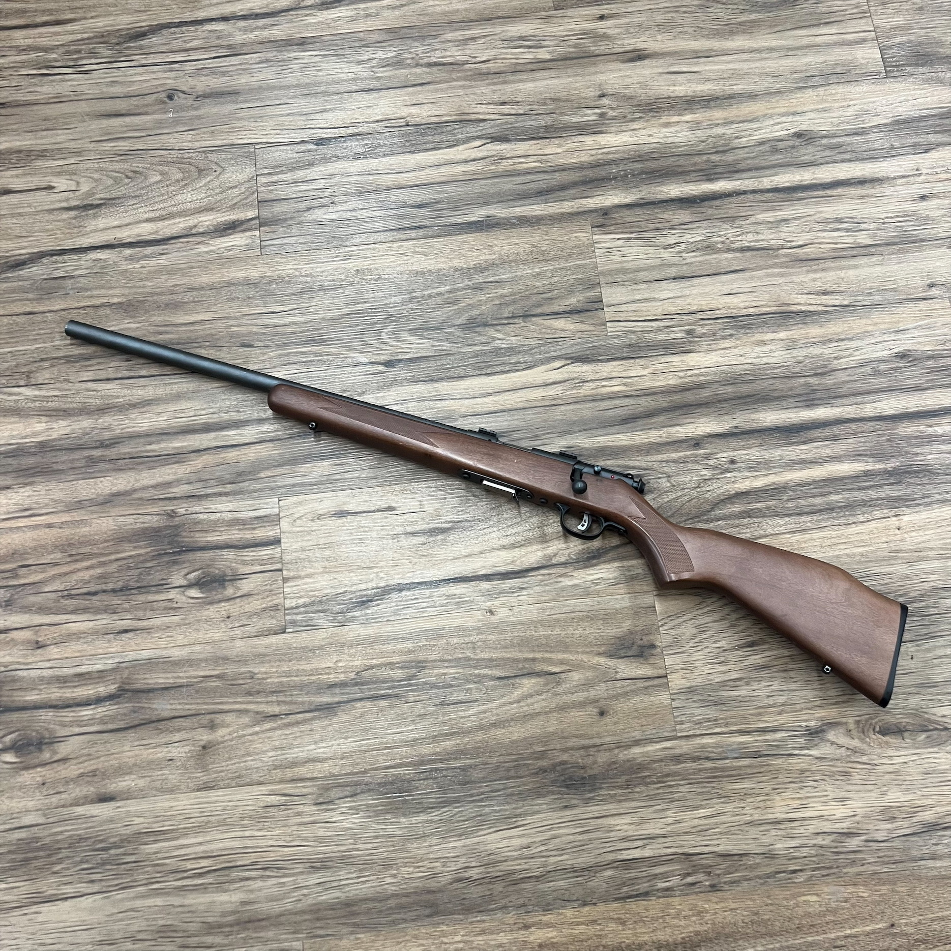 SAVAGE SAVAGE 93R17GV RIFLE, 17 HMR, LEFT HAND, WOOD STOCK, HEAVY BARREL, PRE-OWNED