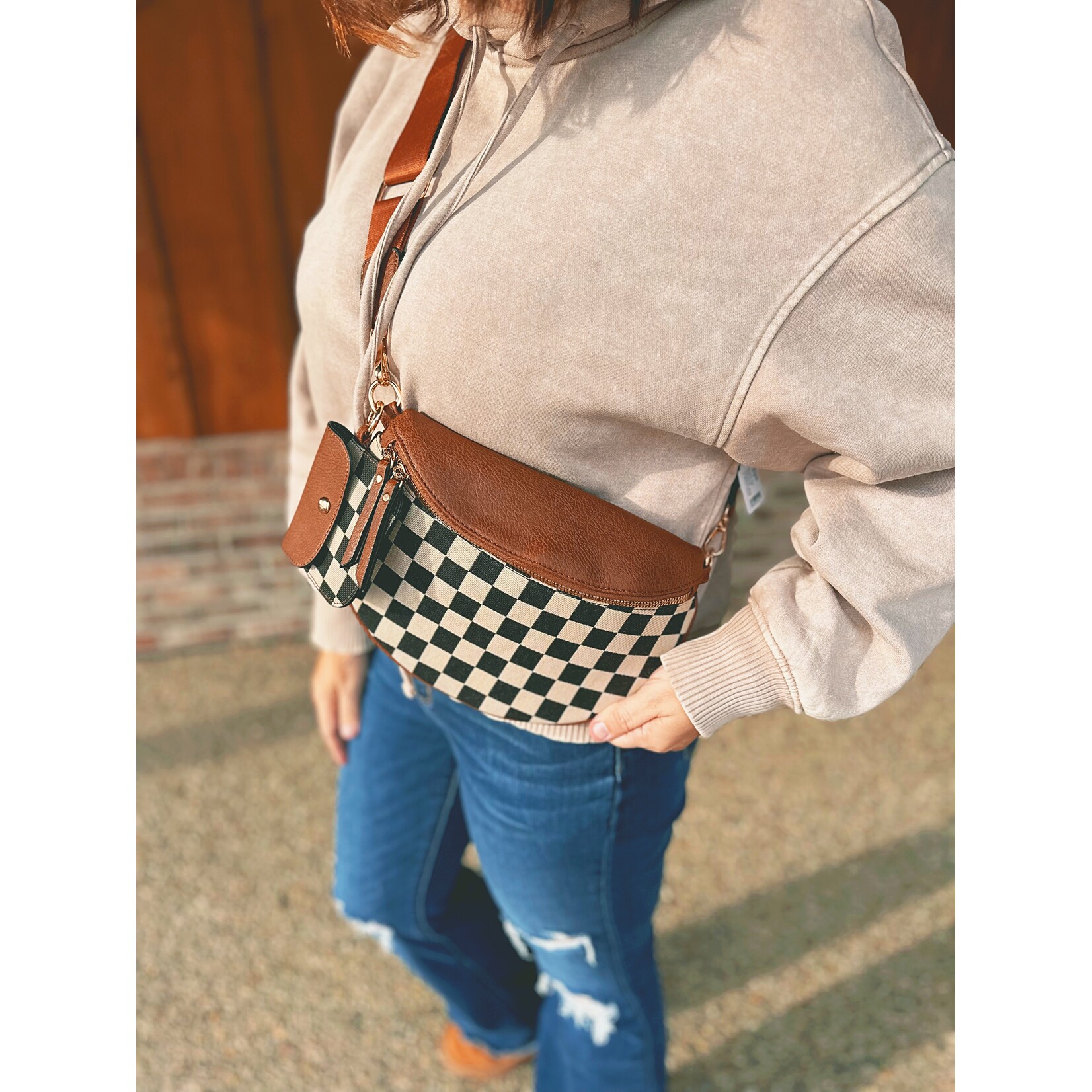 Zenana Zenana Duo Checkered Crossbody Sling & Wallet This Zenana duo set is the perfect blend of style and function. Featuring a matching crossbody sling bag and wallet, both crafted from soft vegan leather with a timeless checkered design, this set is easy to d