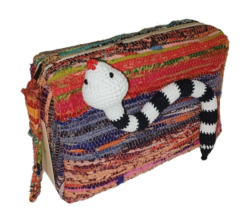 BASMA COLLECTION Multicolor clutch bag made out of upcycled fabric handwoven on wooden looms with crochet black & white snake