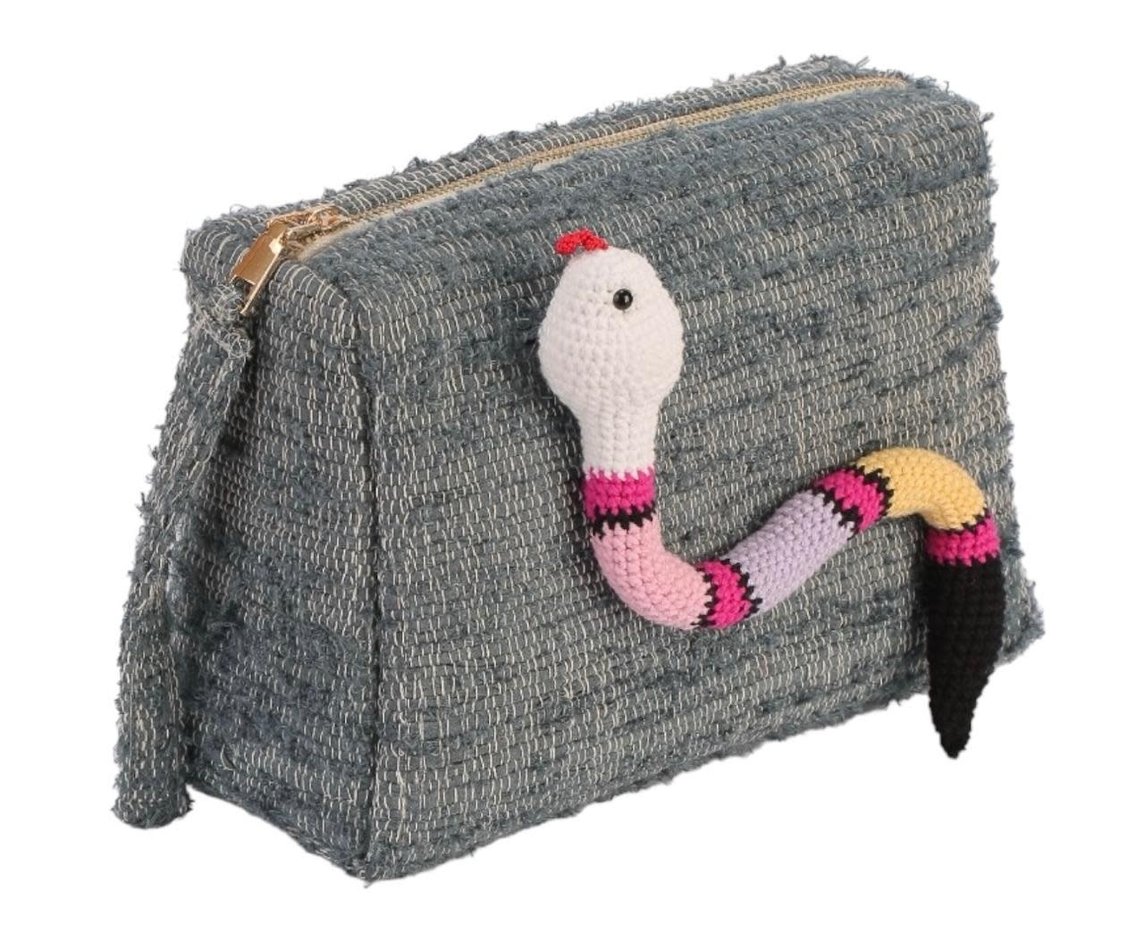 BASMA COLLECTION Light blue clutch made out of upcycled fabric handwoven on wooden looms with pastel crochet snake