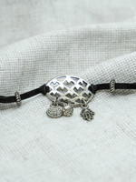 None Bracelet With Cut-Out Pendant and Charms