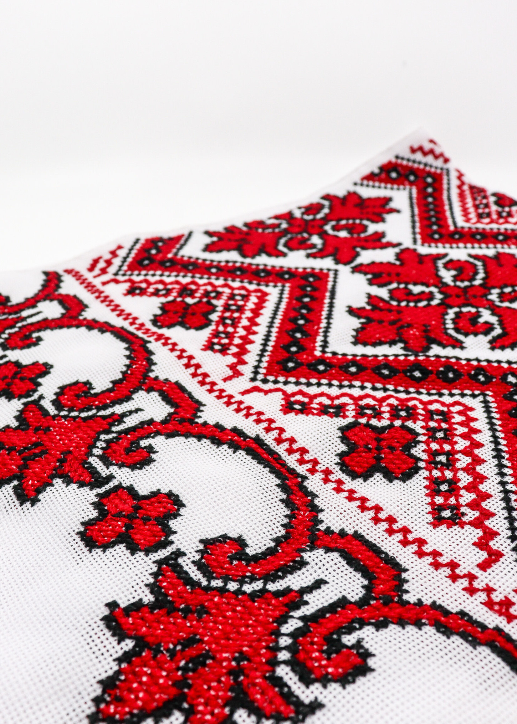 RUSHNYK - White 72x13 1/2 in. Handmade Red/Black geometrical pattern