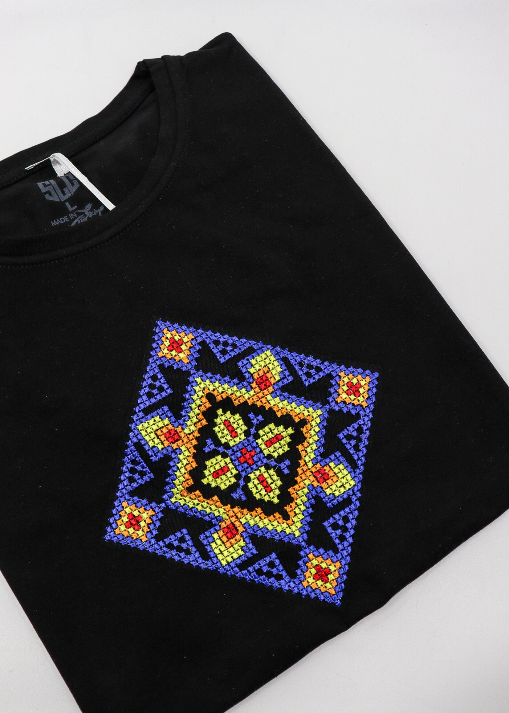 APPAREL - Black T-Shirt (W), with a diamond shaped colorful embroidery