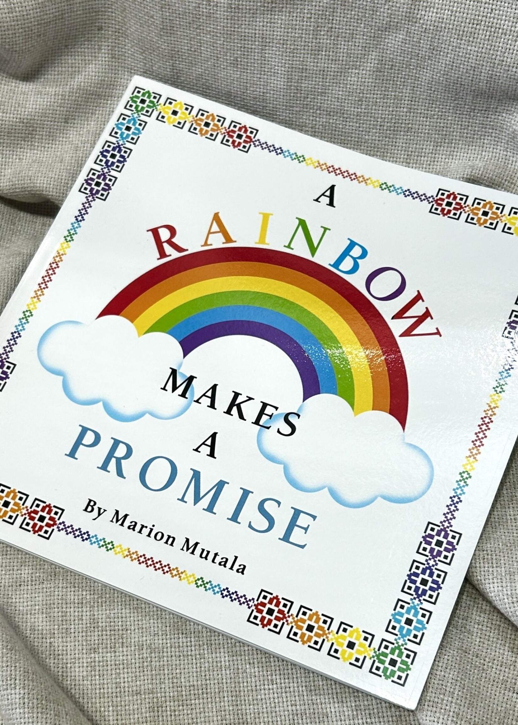 BOOK - A Rainbow Makes A Promise  by Marion Mutala