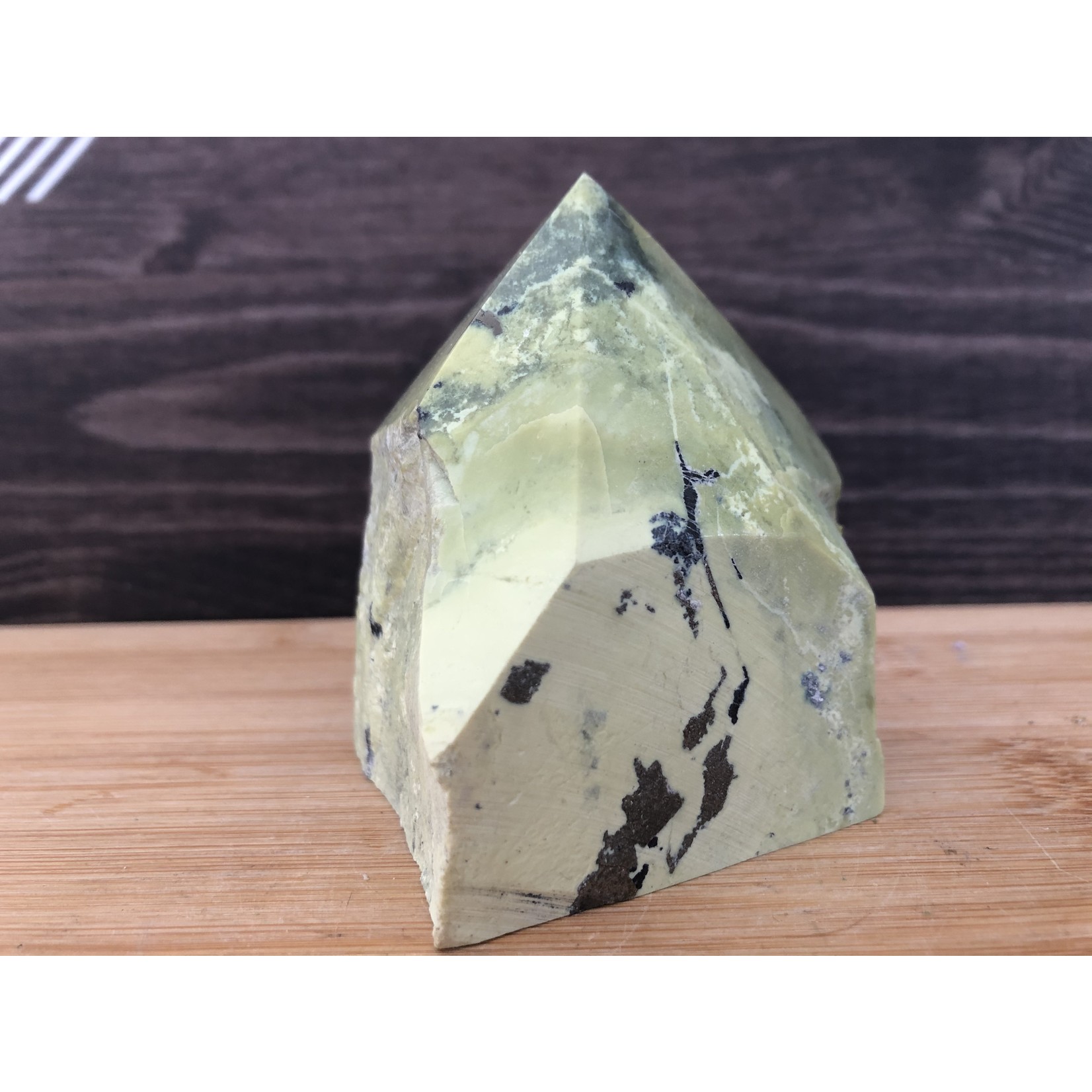 green serpentine stone top polished, natural brazilian serpentine with pyrite, crystal point, stone against migraine