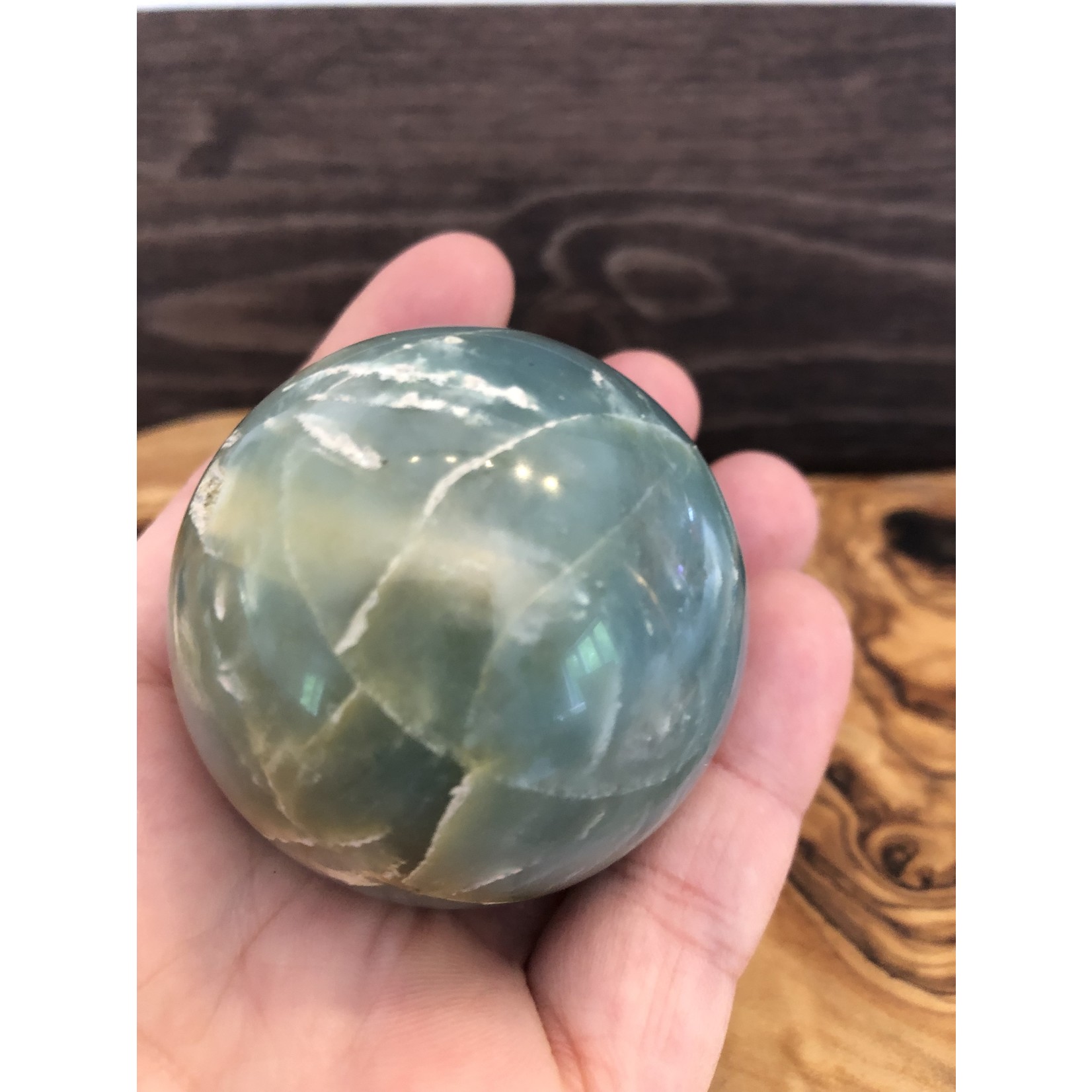 large caribbean calcite sphere, looks like a globe, purifies and aligns the chakras, balances the yin and yang energies
