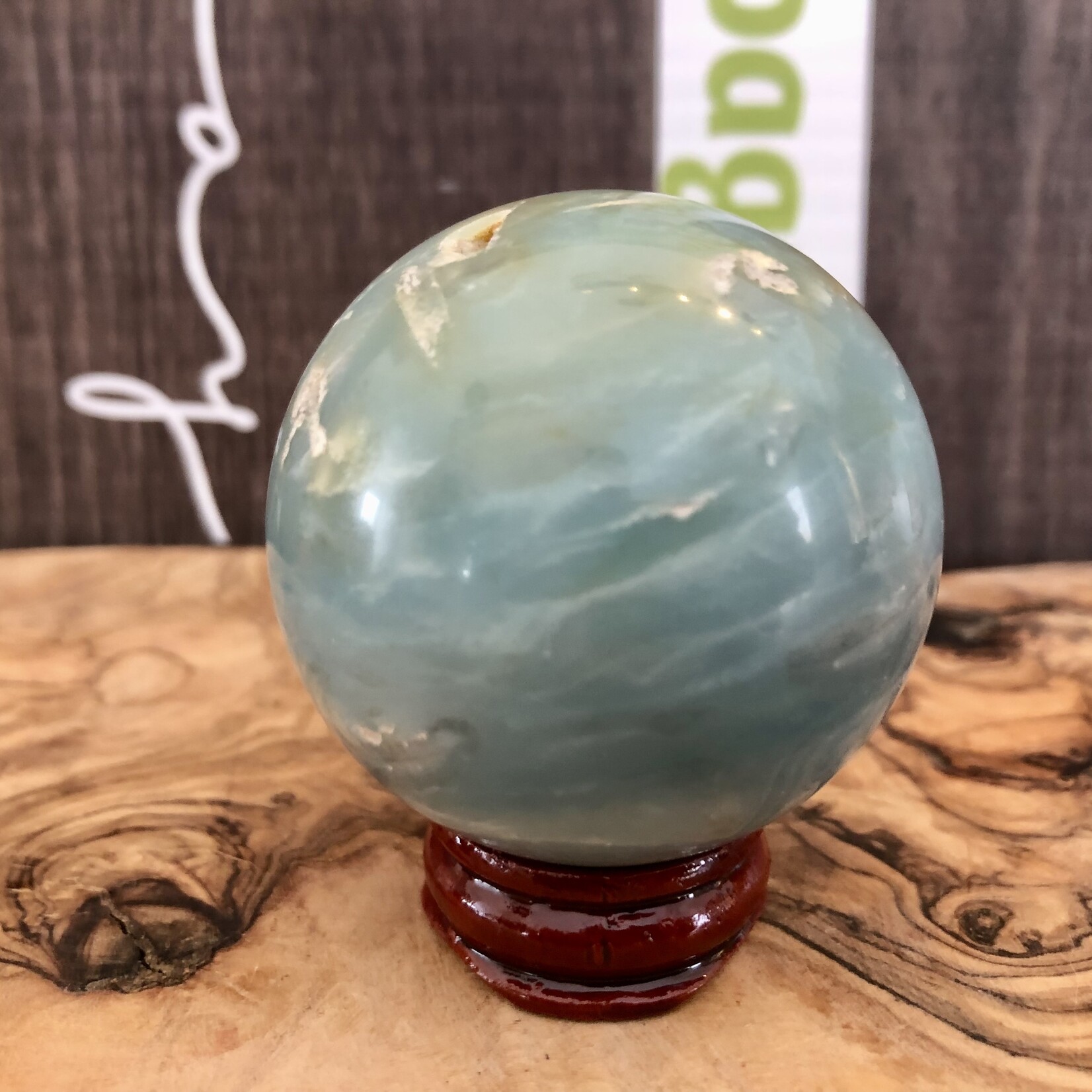 large caribbean calcite sphere, looks like a globe, purifies and aligns the chakras, balances the yin and yang energies
