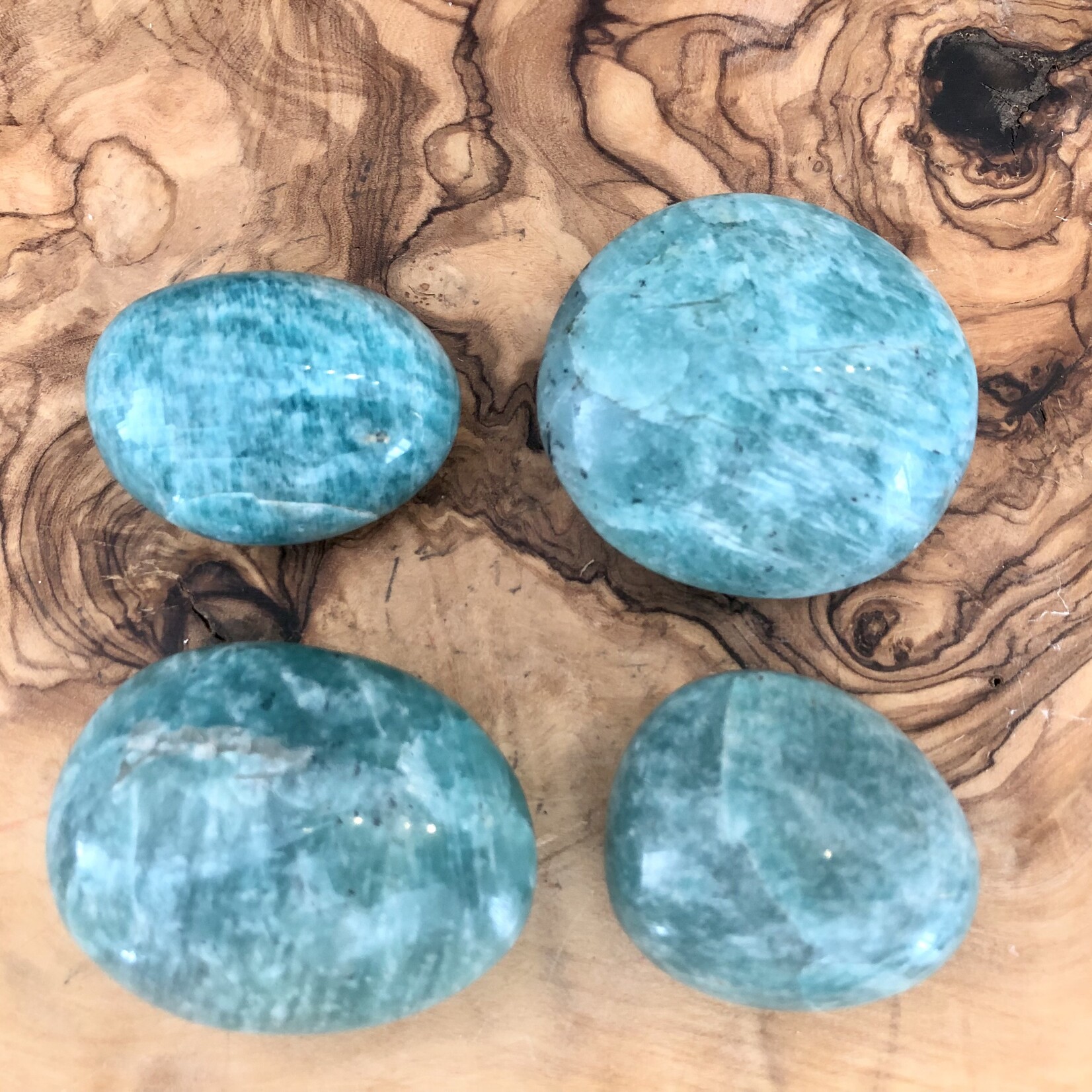 sparkling amazonite tumbled stone, perfect as a palm stone, exacerbates happiness and promotes love, compassion and forgiveness