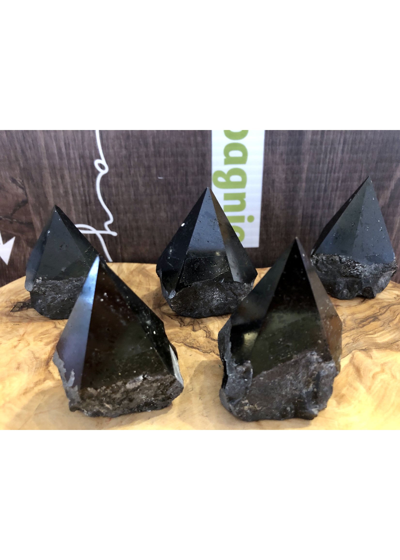 natural black tourmaline top polished, will be mainly used on the root chakra or in contact with the soles of the feet