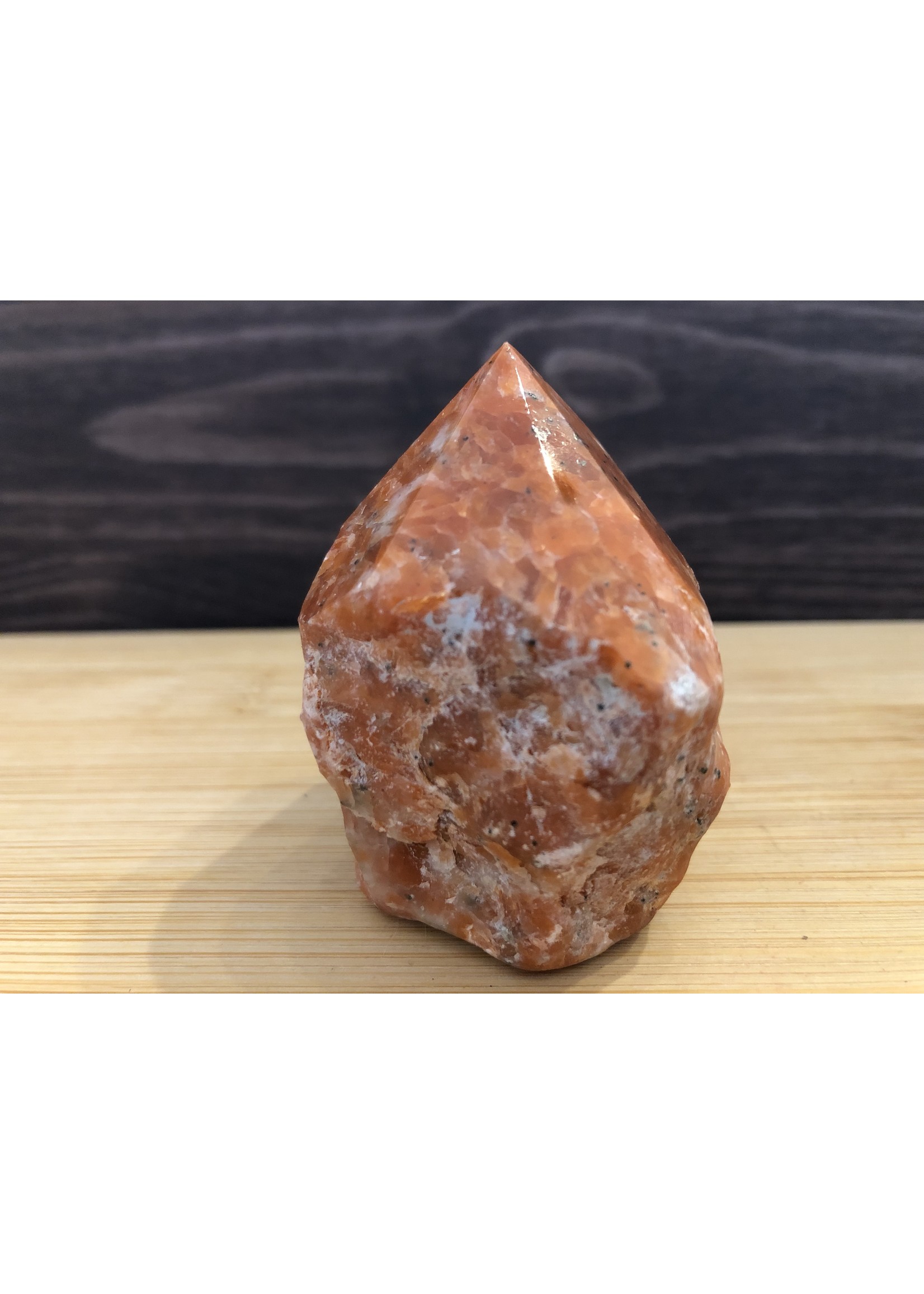 bright polished orange orchid calcite, crystal point orange calcite, is a natural stone that radiates joyful energy