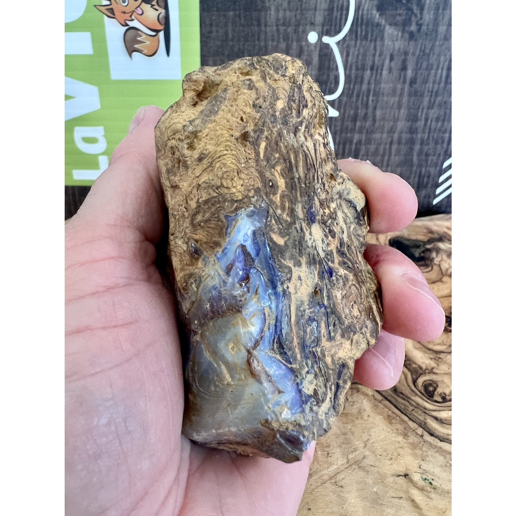 piece of boulder opal purple, symbolizes light, hope, appeasement and harmony