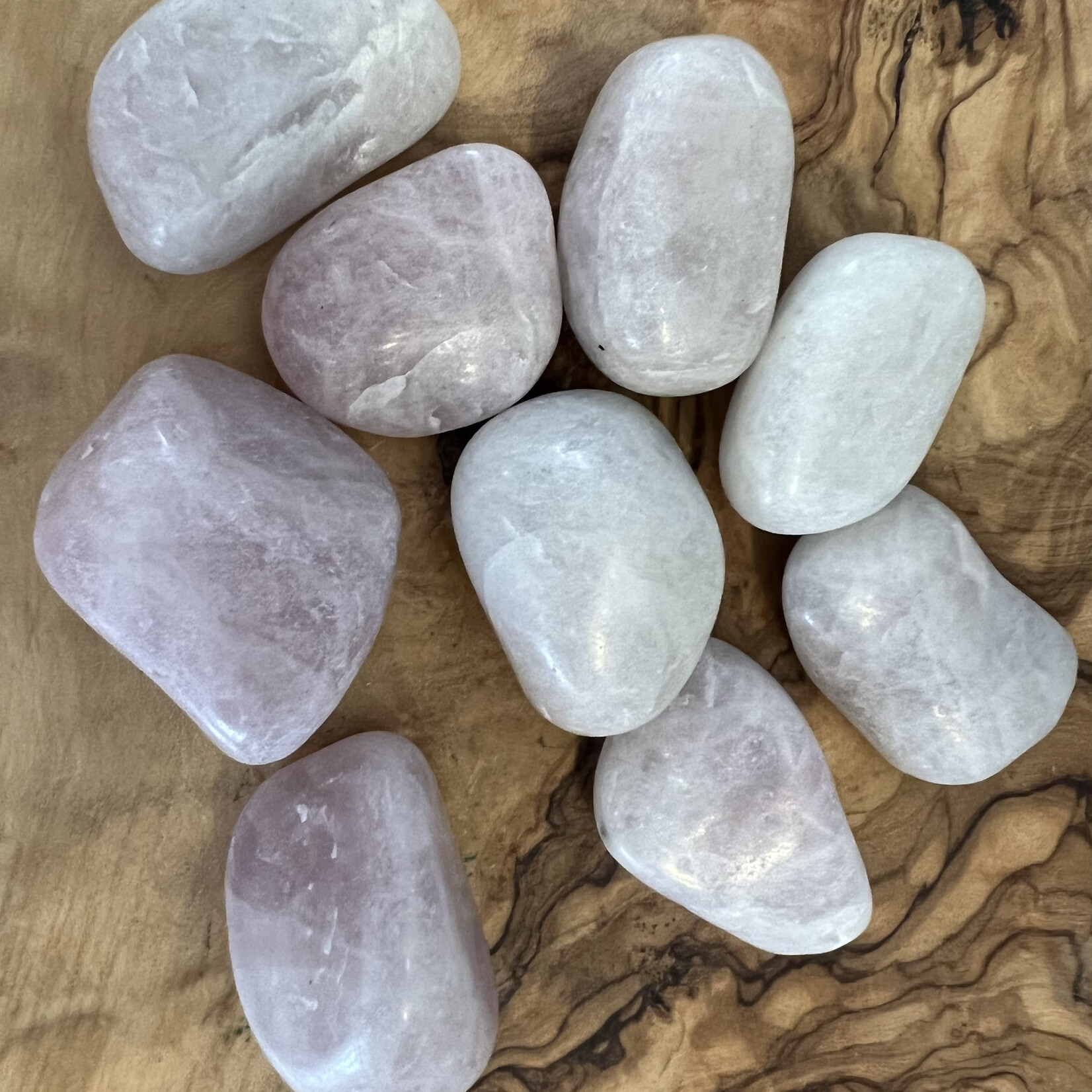 kunzite tumbled stone, used to calm migraines, neck pain due to blood pressure, exhaustion or overwork