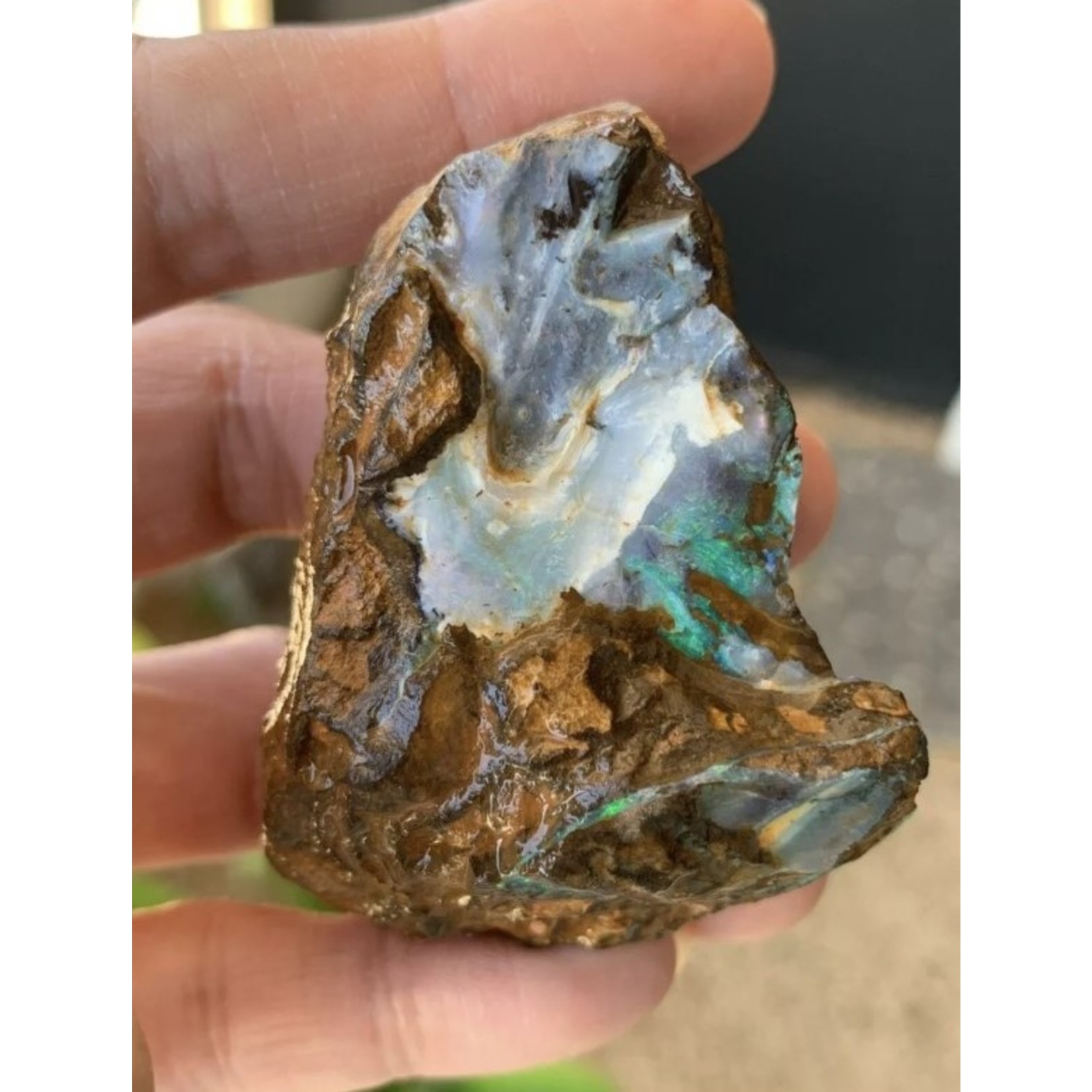 small boulder opal sea wave, symbolizes light, hope, appeasement and harmony