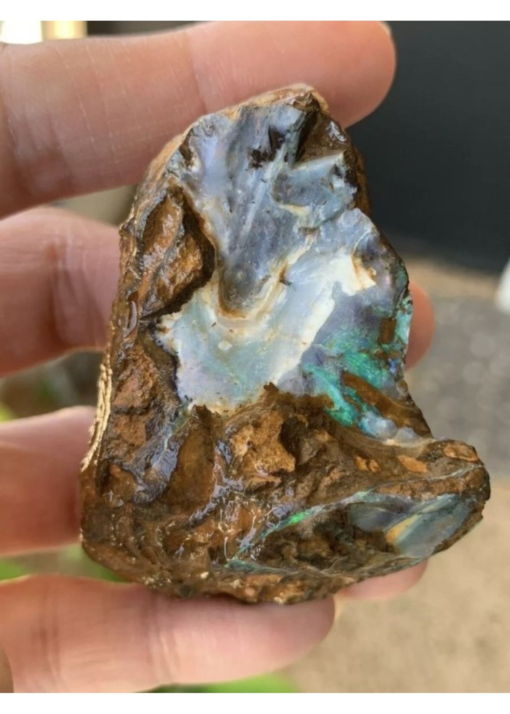 small boulder opal sea wave, symbolizes light, hope, appeasement and harmony