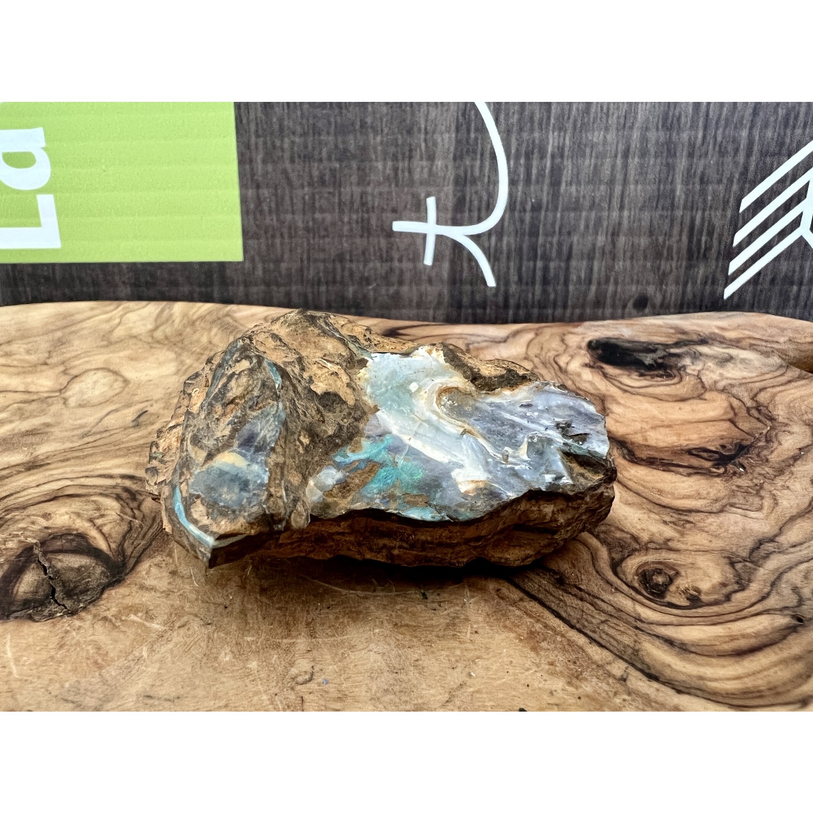 small boulder opal sea wave, symbolizes light, hope, appeasement and harmony