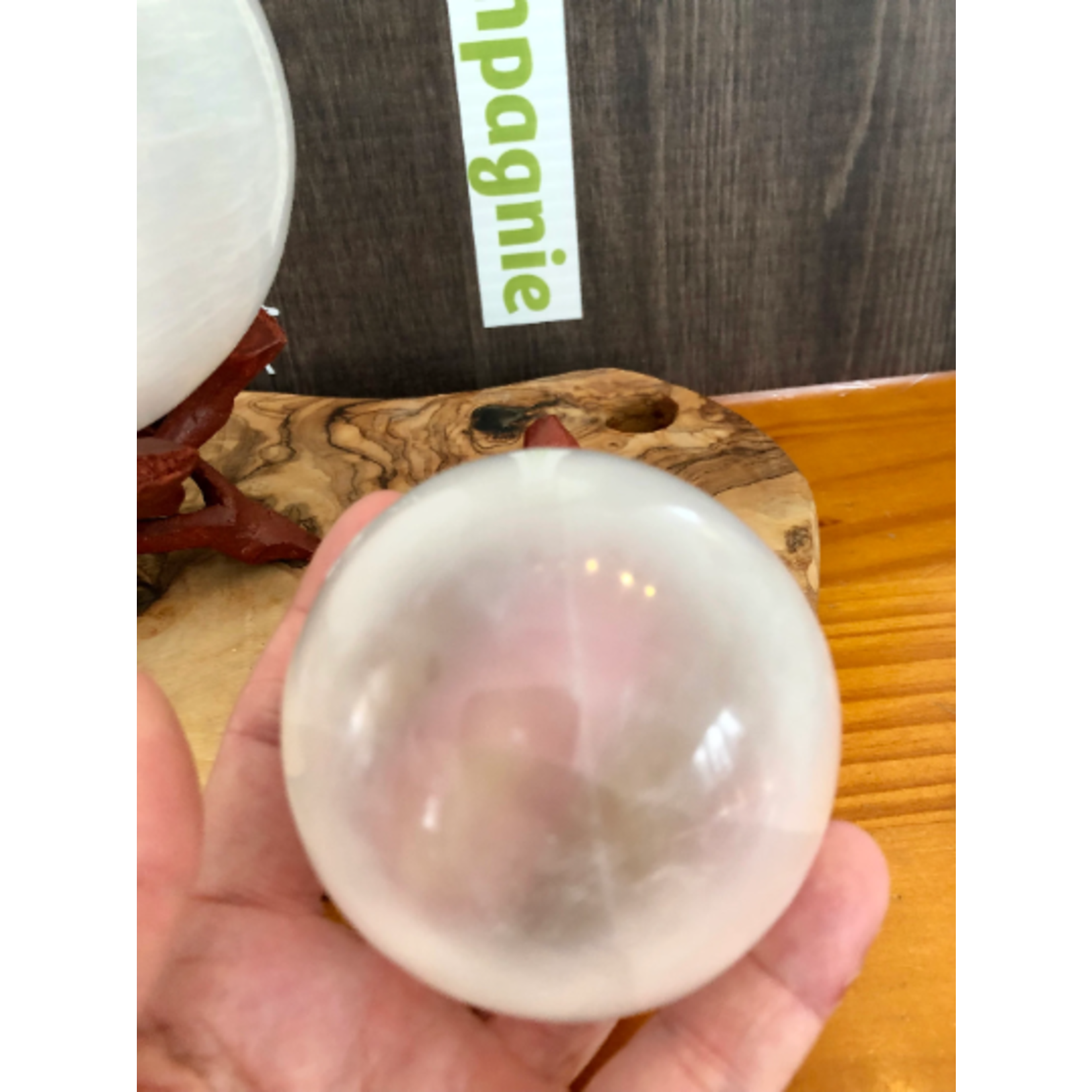 selenite sphere, selenite ball, light base LED available in the store,  is known to act as a purifying and charging agent for your crystals