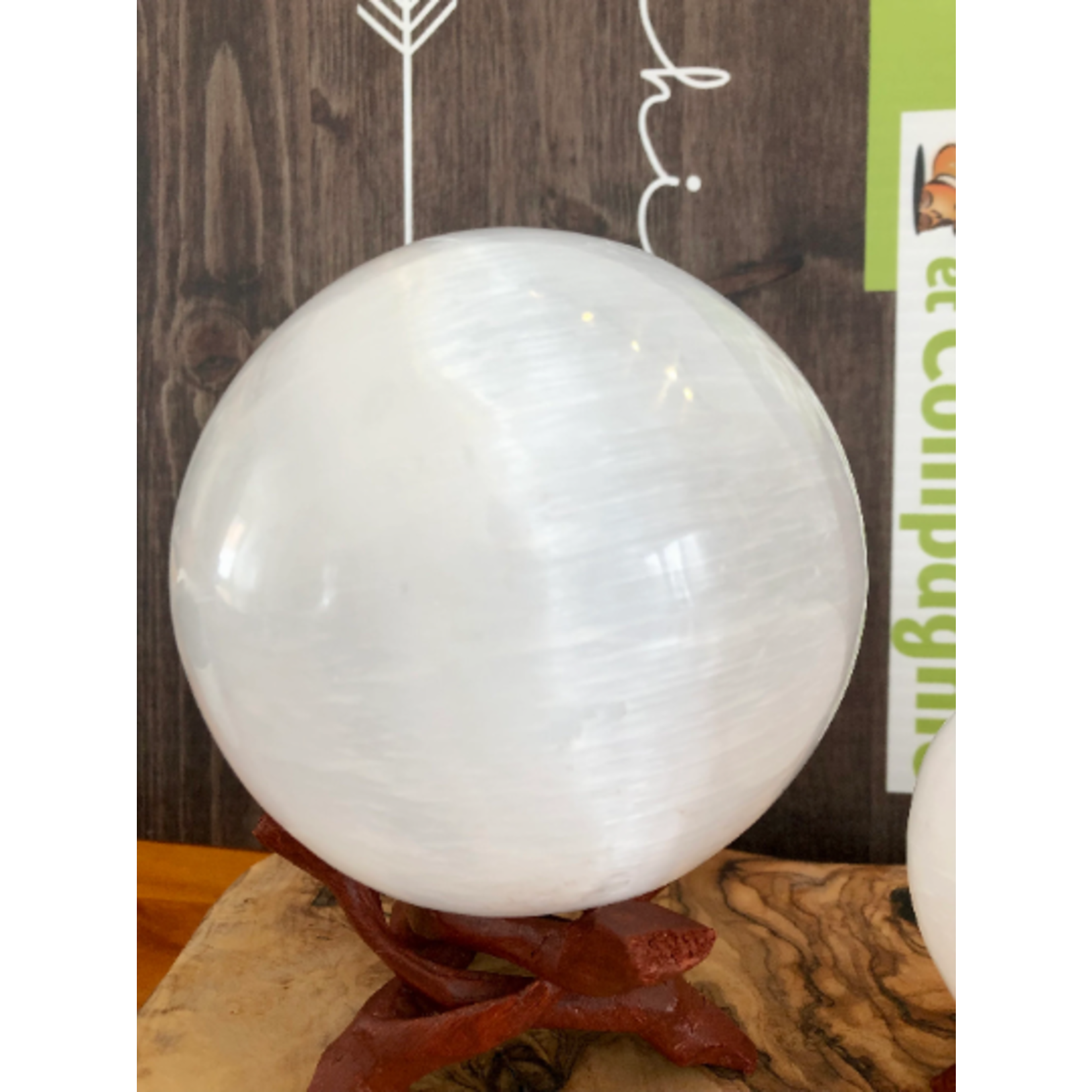 selenite sphere, selenite ball, light base LED available in the store,  is known to act as a purifying and charging agent for your crystals