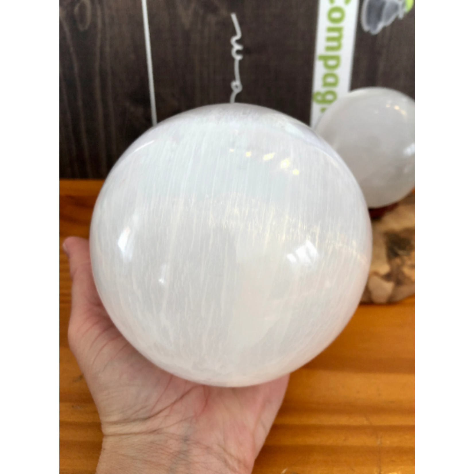 selenite sphere, selenite ball, light base LED available in the store,  is known to act as a purifying and charging agent for your crystals