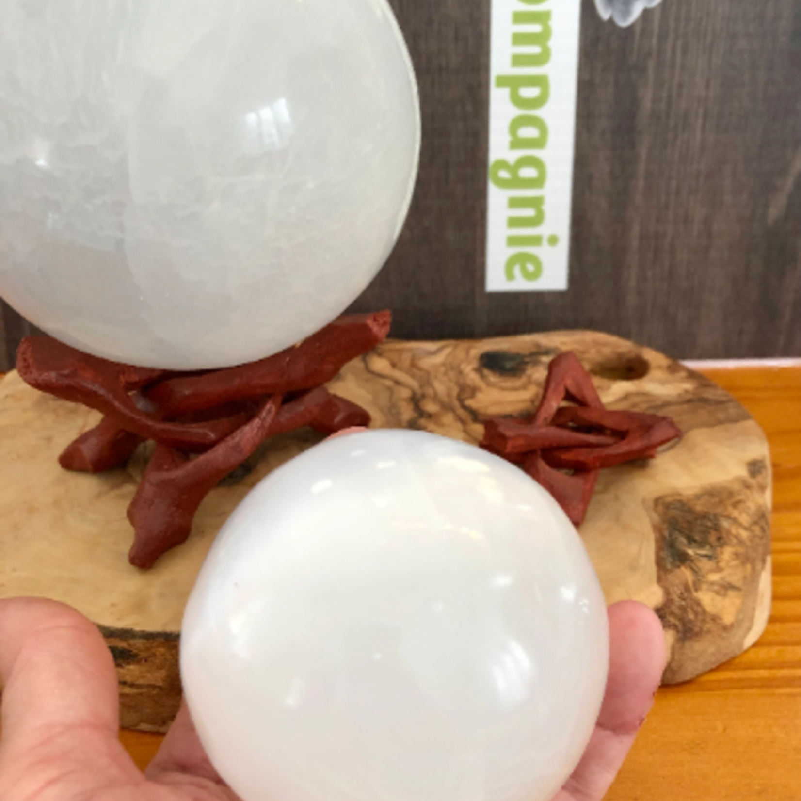 selenite sphere, selenite ball, light base LED available in the store,  is known to act as a purifying and charging agent for your crystals