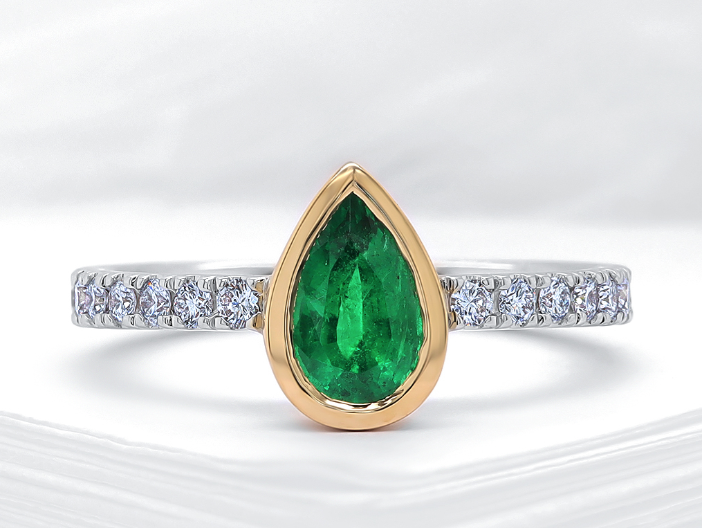Bag 18K Eme poire .64ct dia .31ct gr 6.5