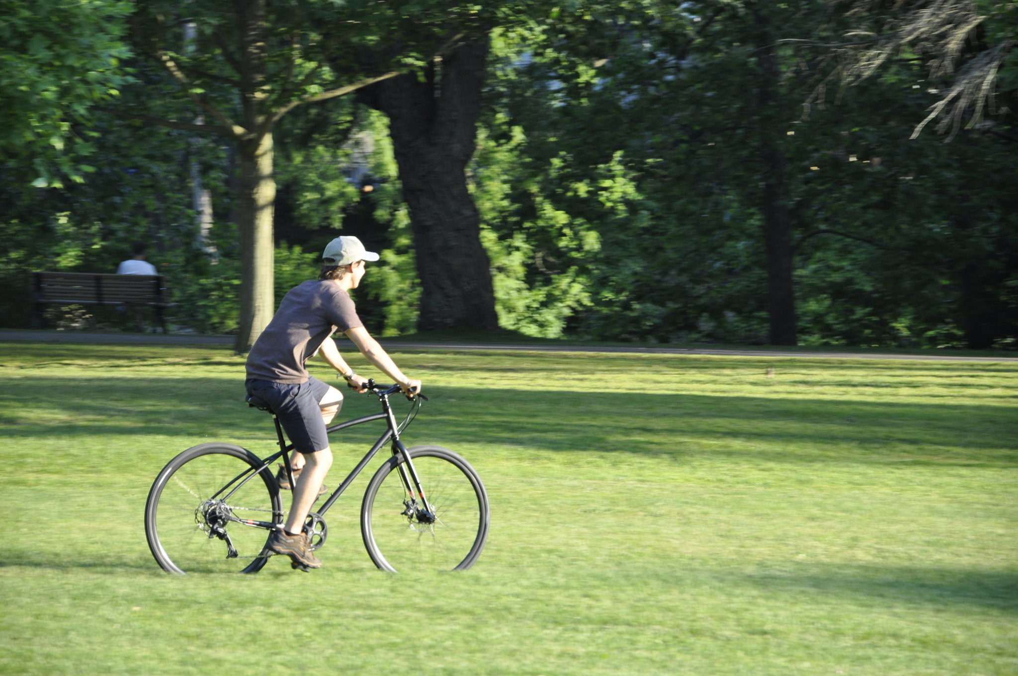 Giancarlo rides through the park on a Pure Cycles bicycle.