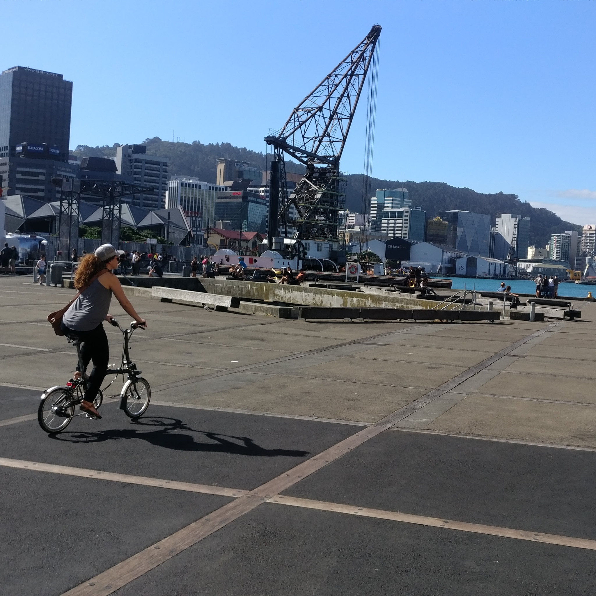 Caroline rides her Brompton on a seaside trail