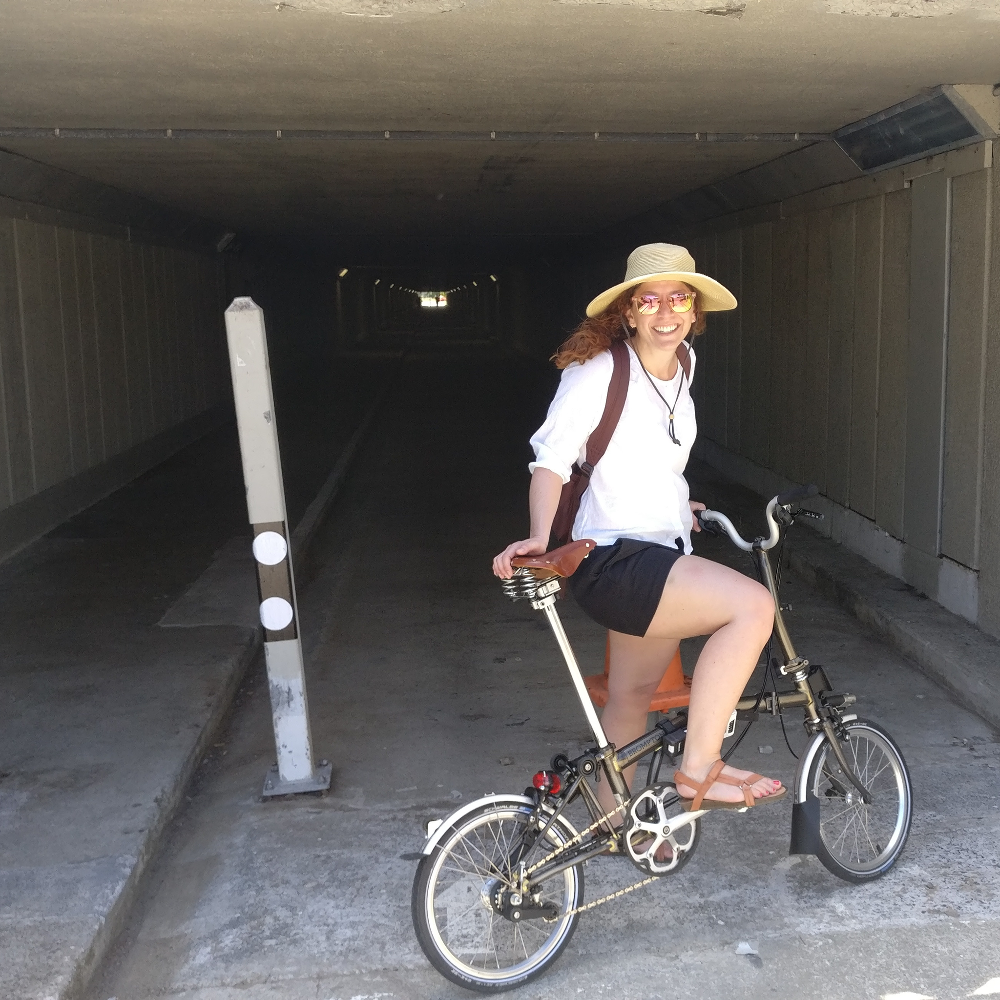 Smiling Caroline in front of the tunnel.