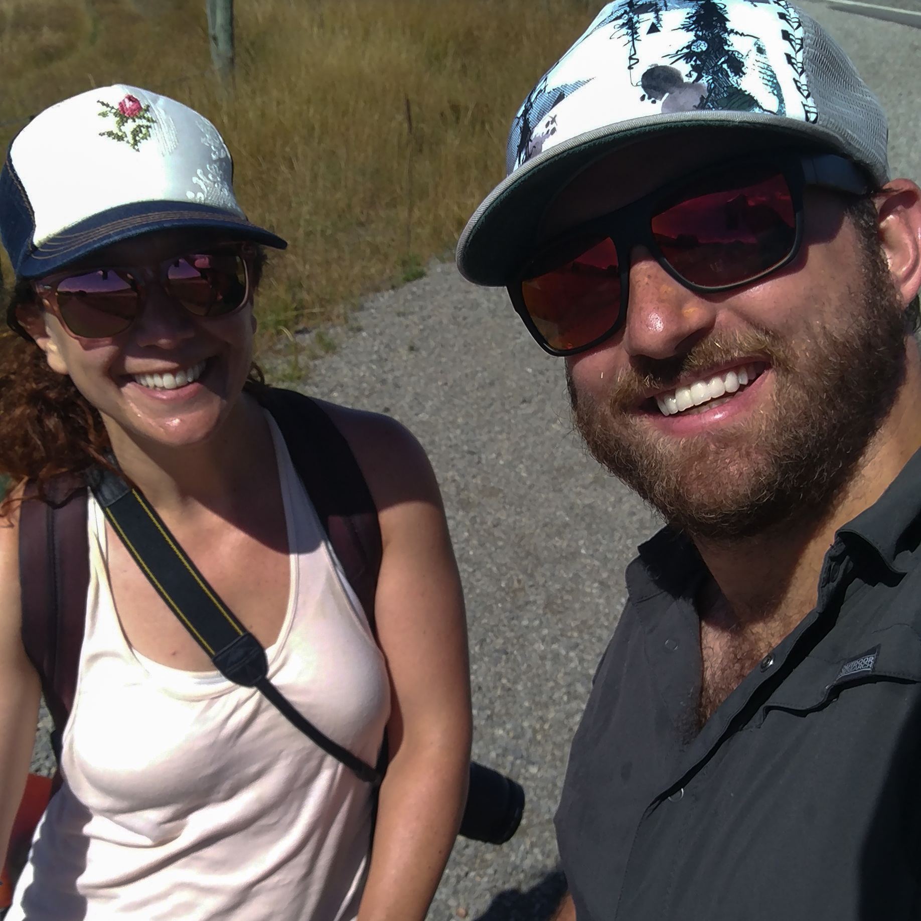 Ben and Caroline take a smiling selfie in the sun.