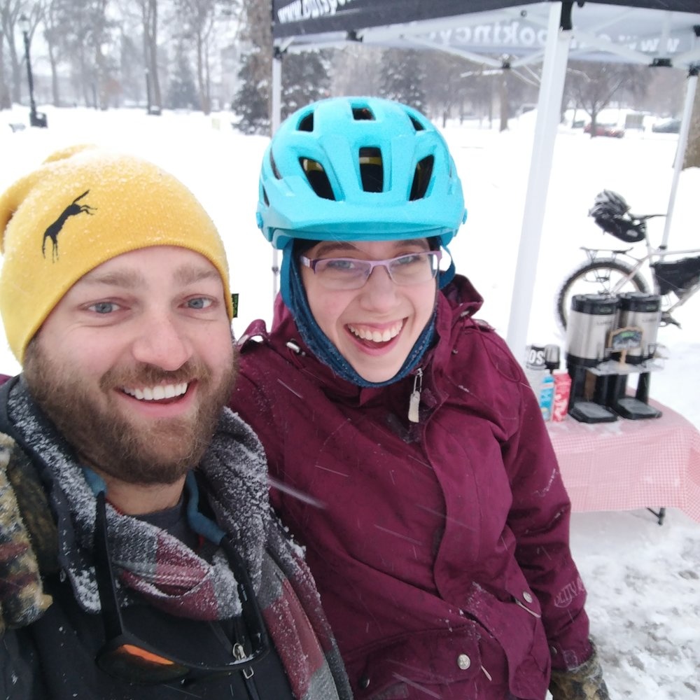 Ben and Joy smile at the camera in their winter gear.