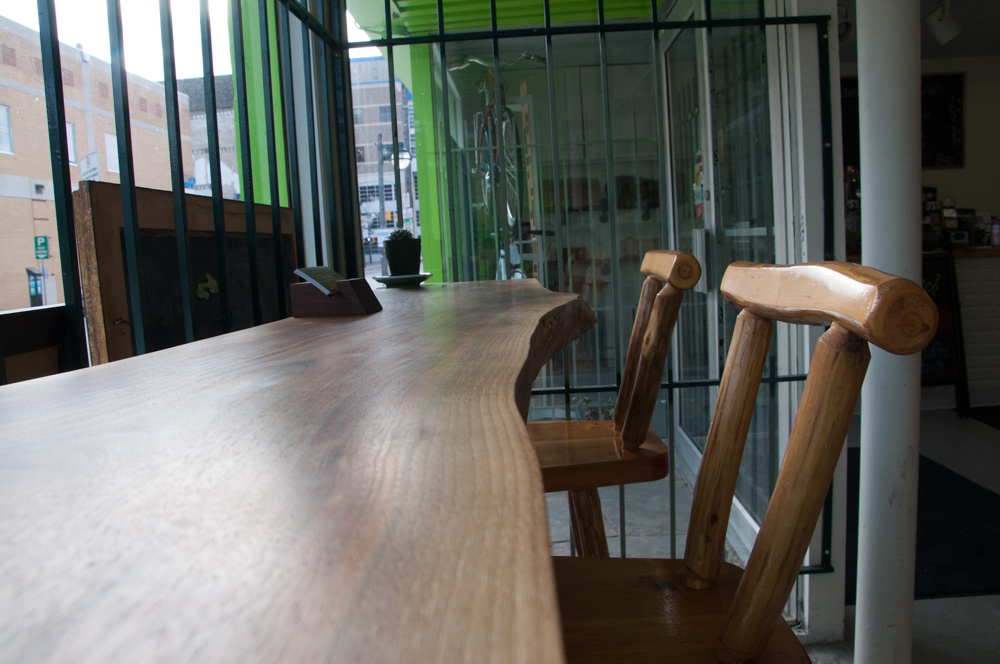 A close up of a custom raw wood edge counter/ledge.