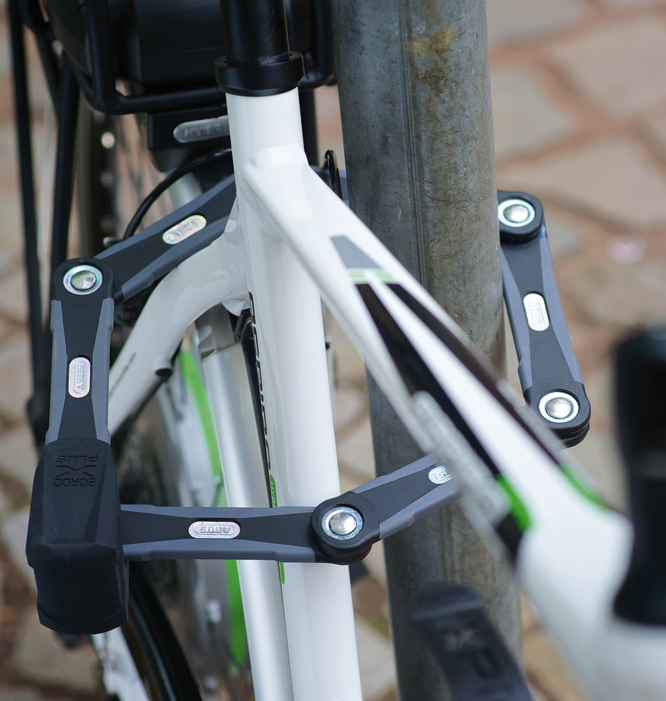 An Abus Bordo folding lock around a bike.