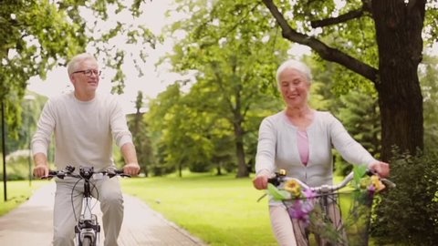 An older couple enjoy a leisurely ride