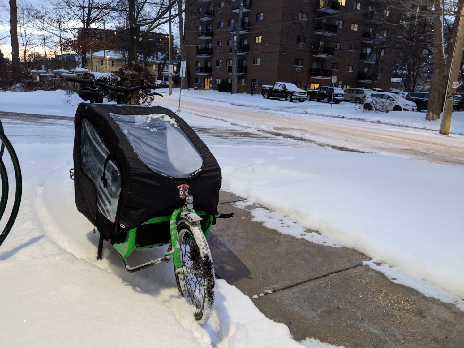The green Bullitt bike on another snowy street