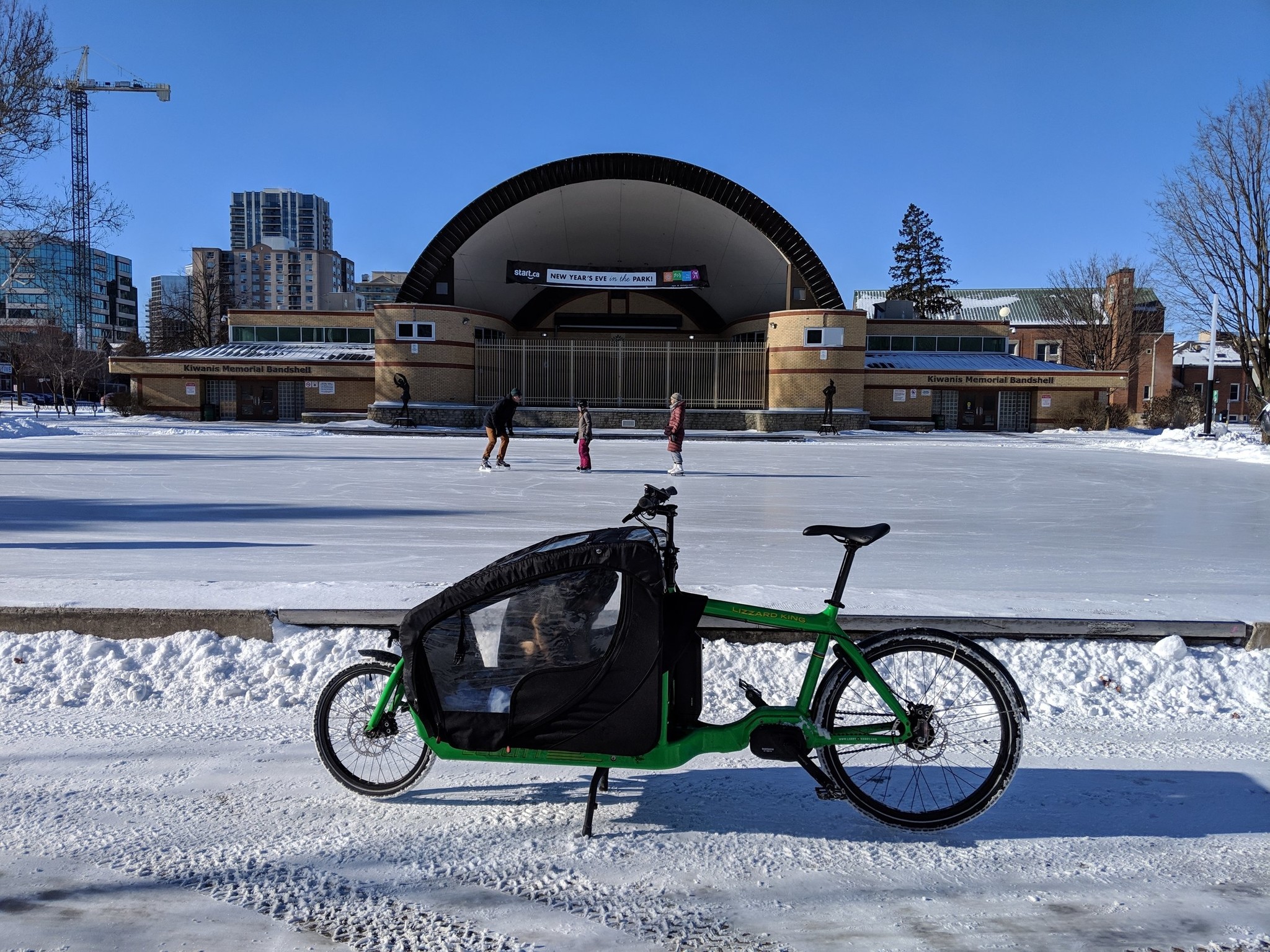 The Bullitt in front of a skating rink beyond which is a large outdoor bandshell.