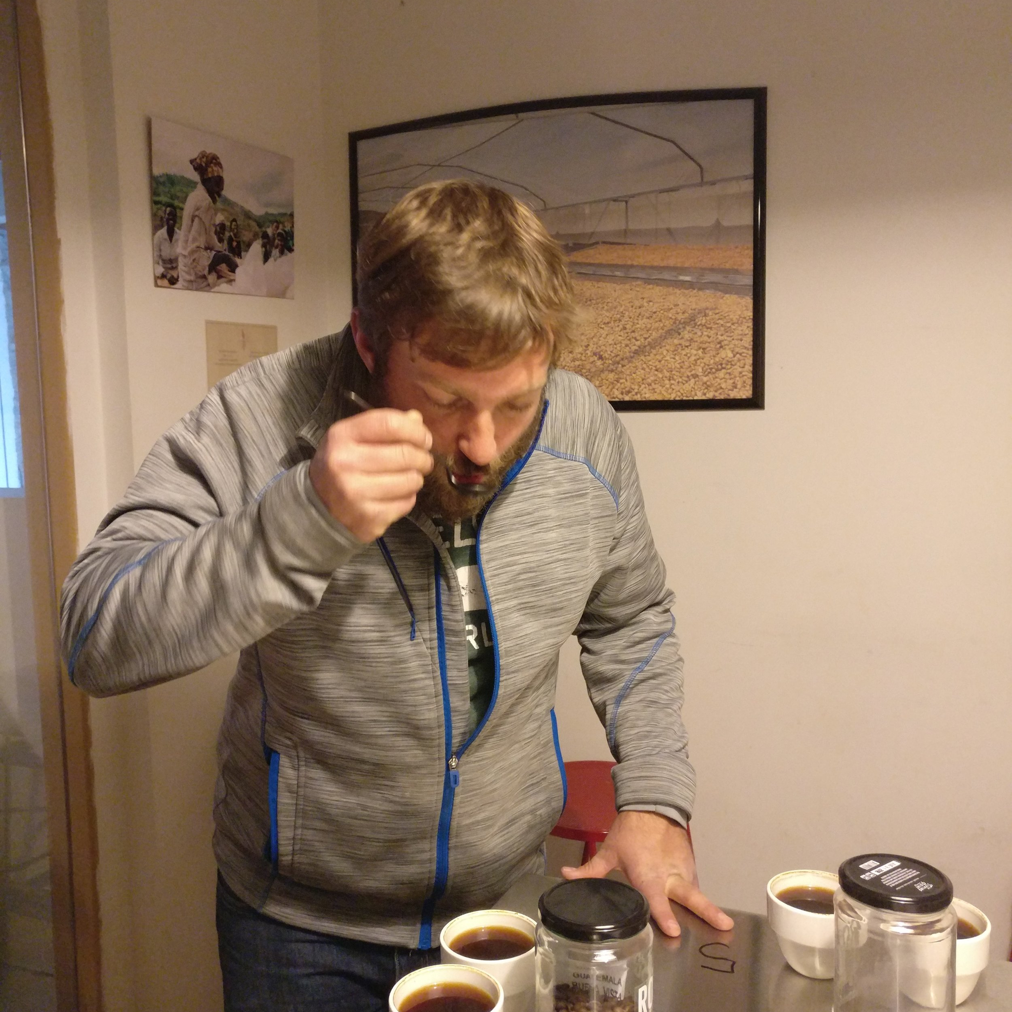 Ben participates in a "cupping" coffee tasting, slurping the coffee to get the most flavour.