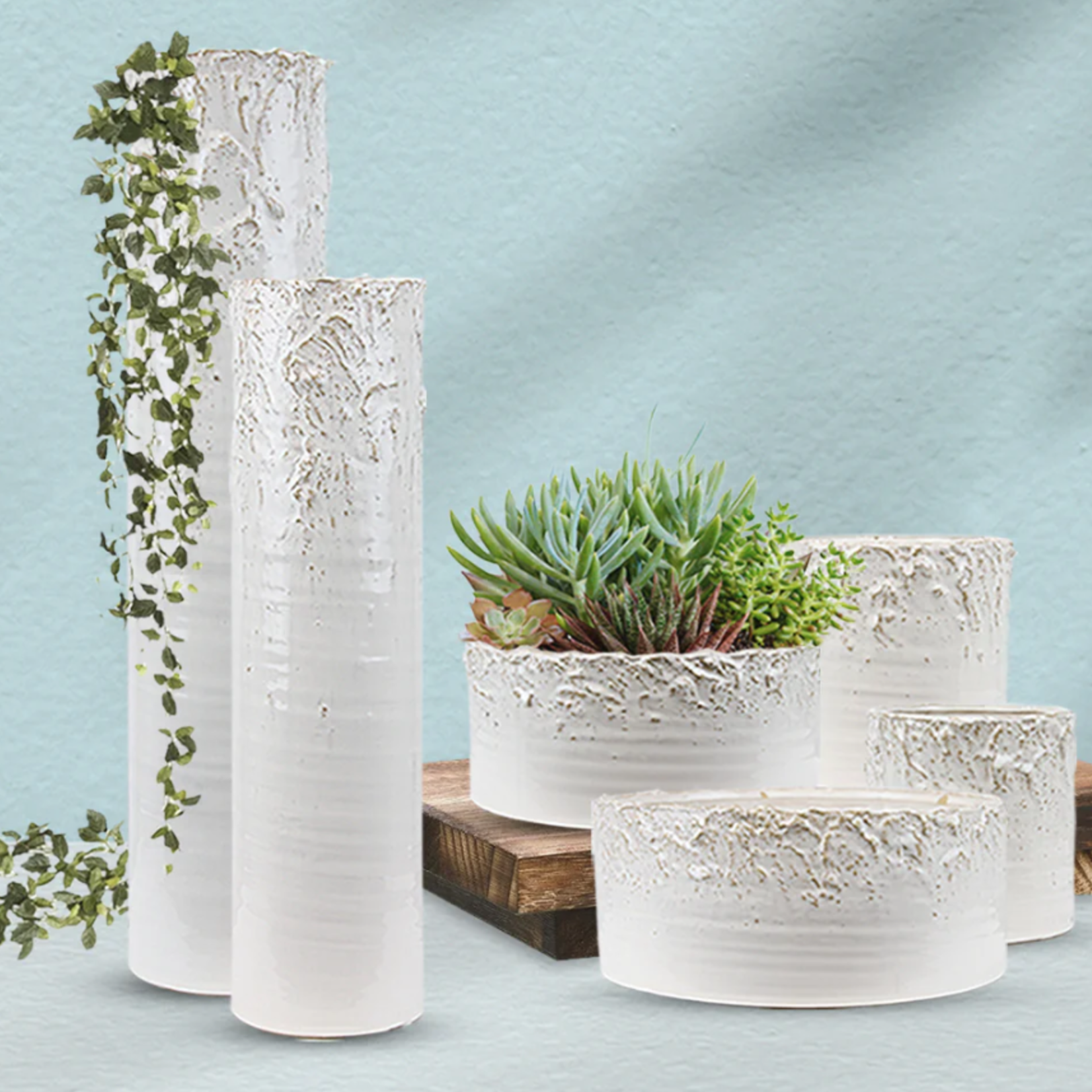 40% off was $40 now $24. 22.5”H X 5.5” ASPEN WHITE CERAMIC PLANTERS