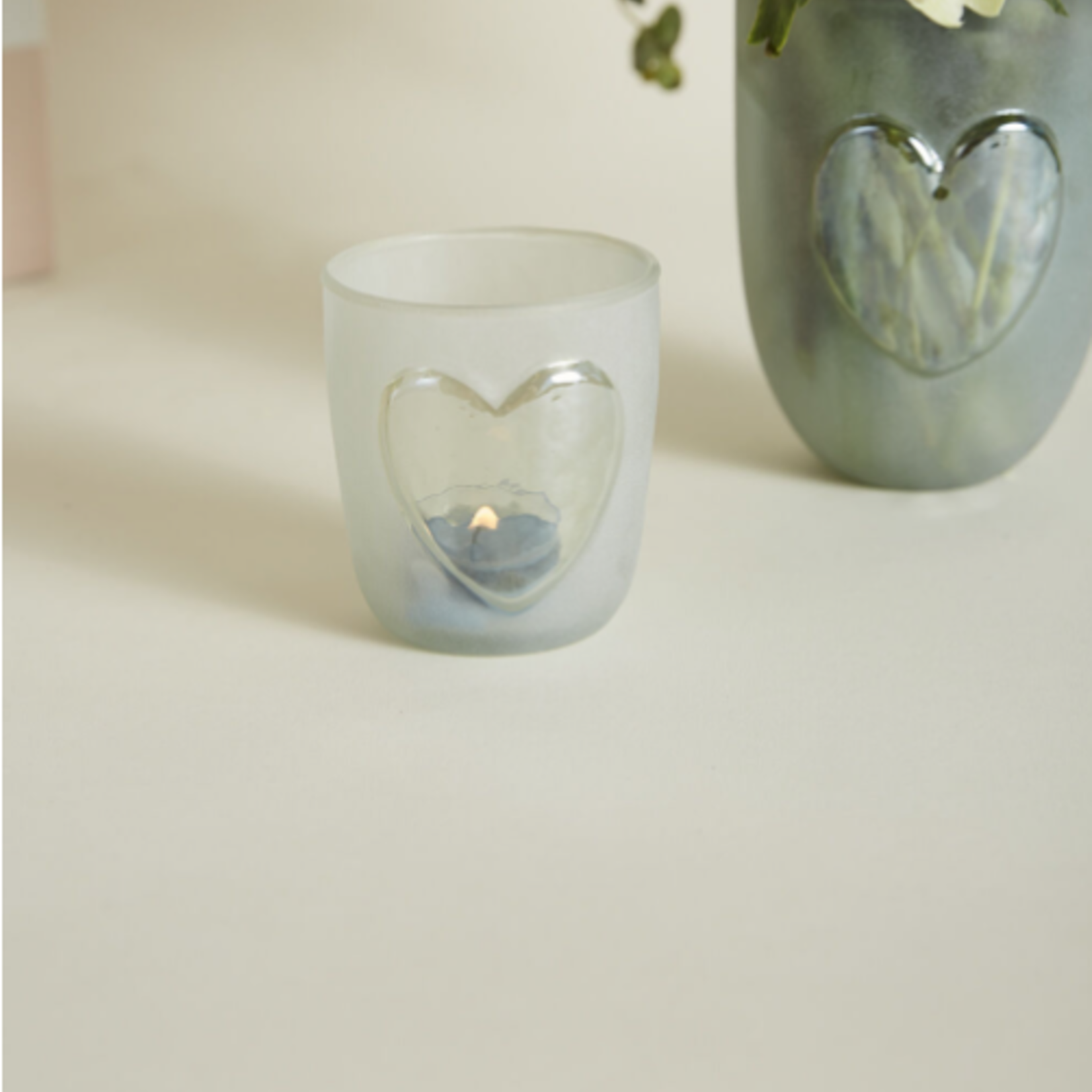 50% off was $6.40 now $3.20. 3.5”H X 3” GLASS HEARTS AGLOW VASE/VOTIVE