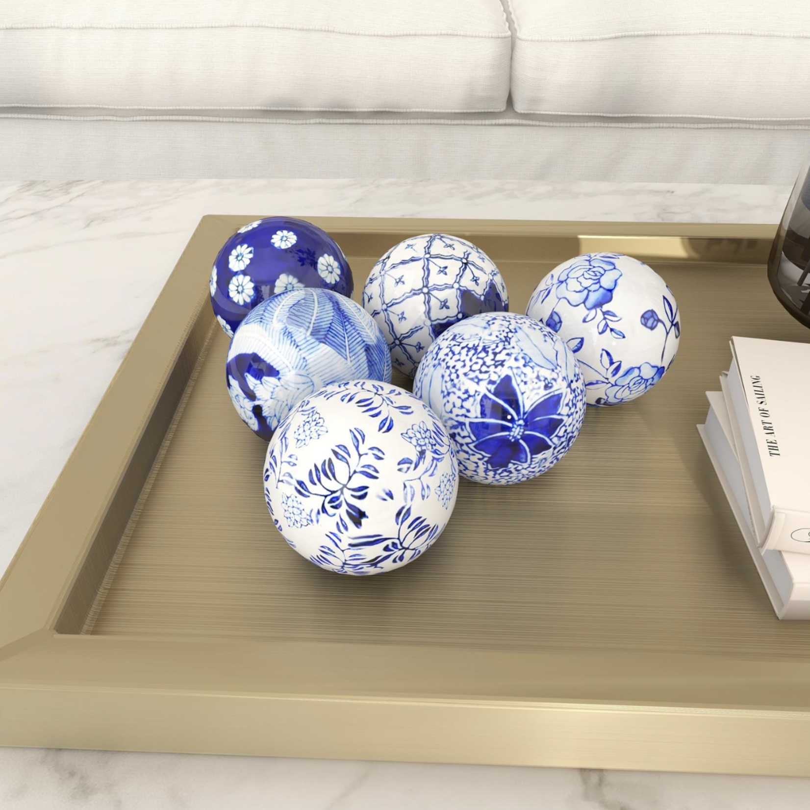 50% off was $7 now $3.50. 3.15”d BLUE CERAMIC FLORAL HANDMADE GLOSSY DECORATIVE BALL ORBS & VASE FILLER WITH VARYING PATTERNS (price per each, box has assortment)