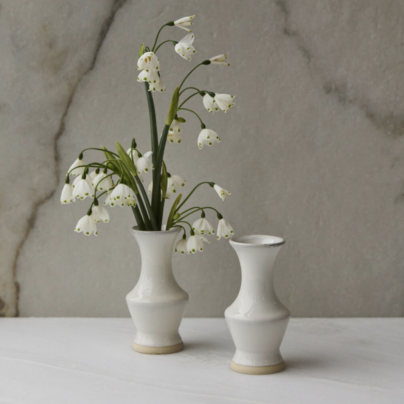 4.75”h x 2.5” WHITE CERAMIC CHASING RAINBOWS BUDVASE