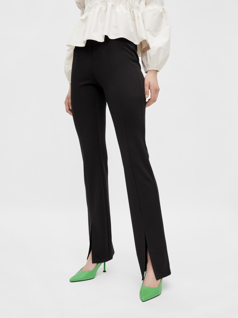 Black flared pants with ankle slit