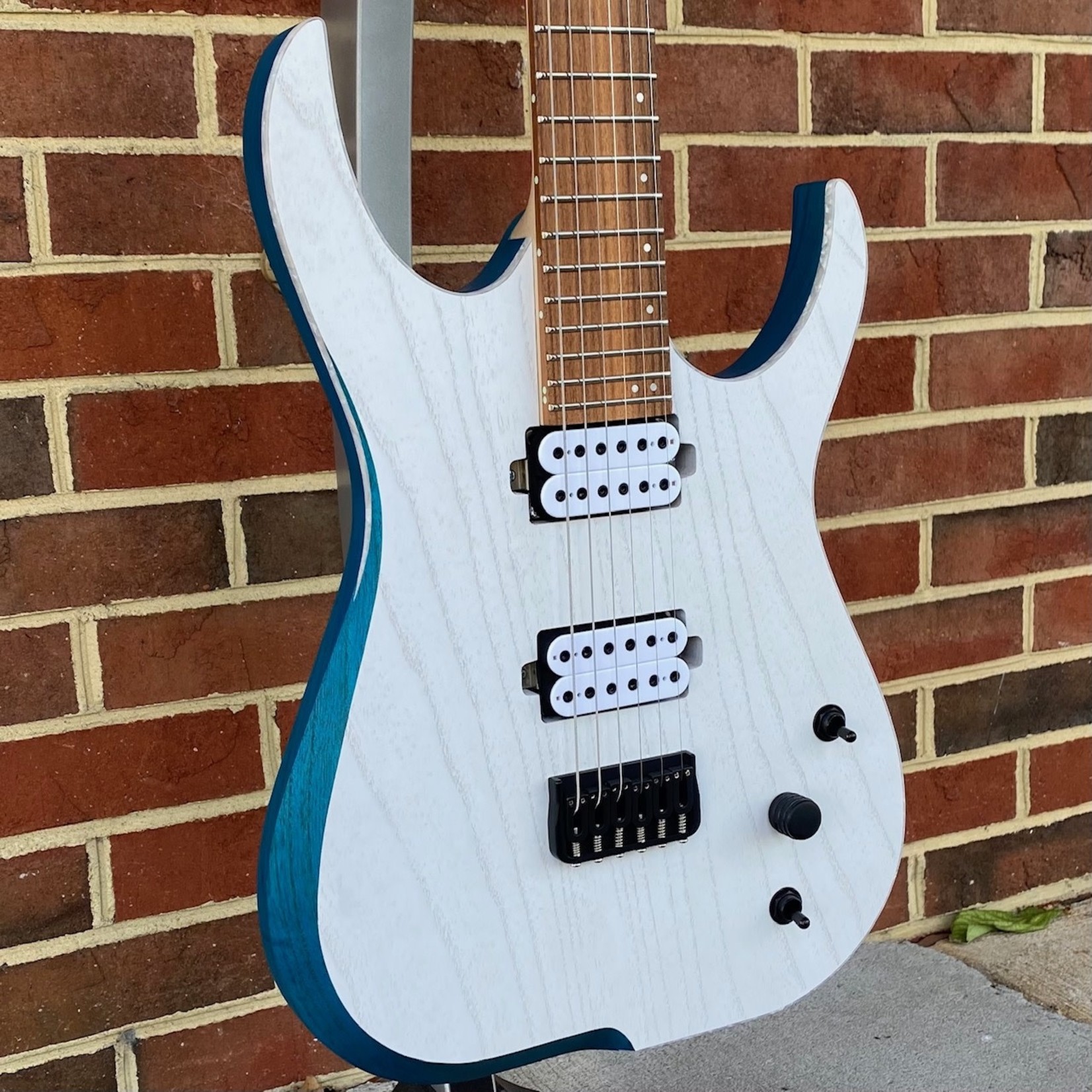 Skervesen Skervesen Velociraptor 6, Trans White Top, Trans Blue Back, White Pearloid Binding, Swamp Ash Body, Maple Neck, Pau Ferro Fretboard, 4AP Headstock, “Skerv” Pickups by Guitarmory, Hipshot Bridge & Locking Tuners, World Domination Mod