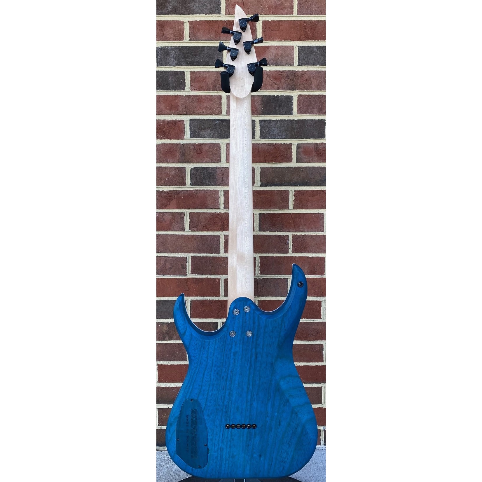 Skervesen Skervesen Velociraptor 6, Trans White Top, Trans Blue Back, White Pearloid Binding, Swamp Ash Body, Maple Neck, Pau Ferro Fretboard, 4AP Headstock, “Skerv” Pickups by Guitarmory, Hipshot Bridge & Locking Tuners, World Domination Mod