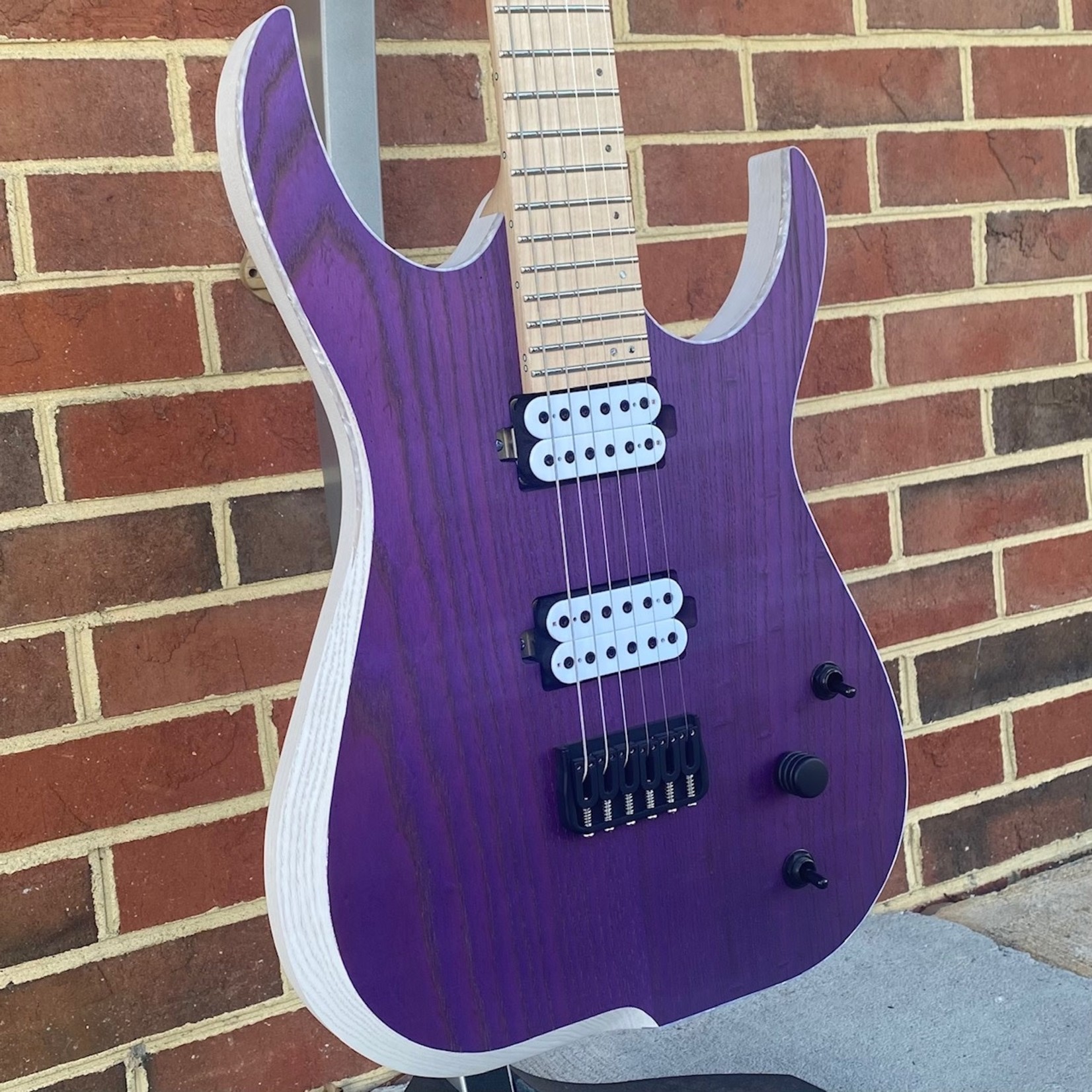 Skervesen Skervesen Velociraptor 6, Trans Purple Top, Trans White Back, White Pearloid Binding, Swamp Ash Body, Maple Neck, Maple Fretboard, Reverse Still Headstock, “Skerv” Pickups by Guitarmory, Hipshot Bridge & Locking Tuners, World Domination Mod