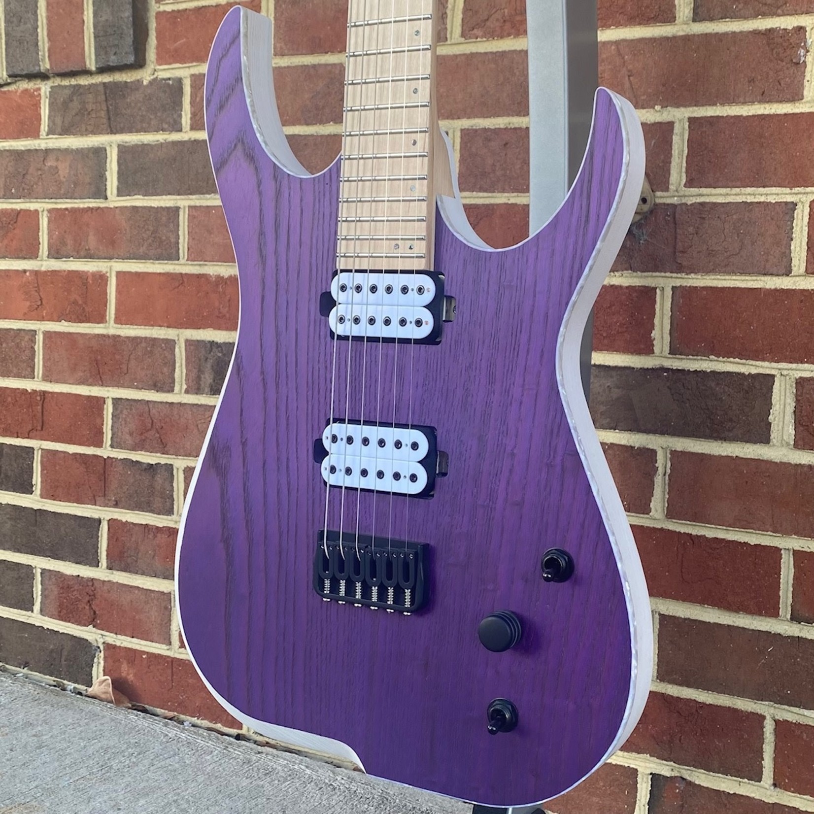 Skervesen Skervesen Velociraptor 6, Trans Purple Top, Trans White Back, White Pearloid Binding, Swamp Ash Body, Maple Neck, Maple Fretboard, Reverse Still Headstock, “Skerv” Pickups by Guitarmory, Hipshot Bridge & Locking Tuners, World Domination Mod