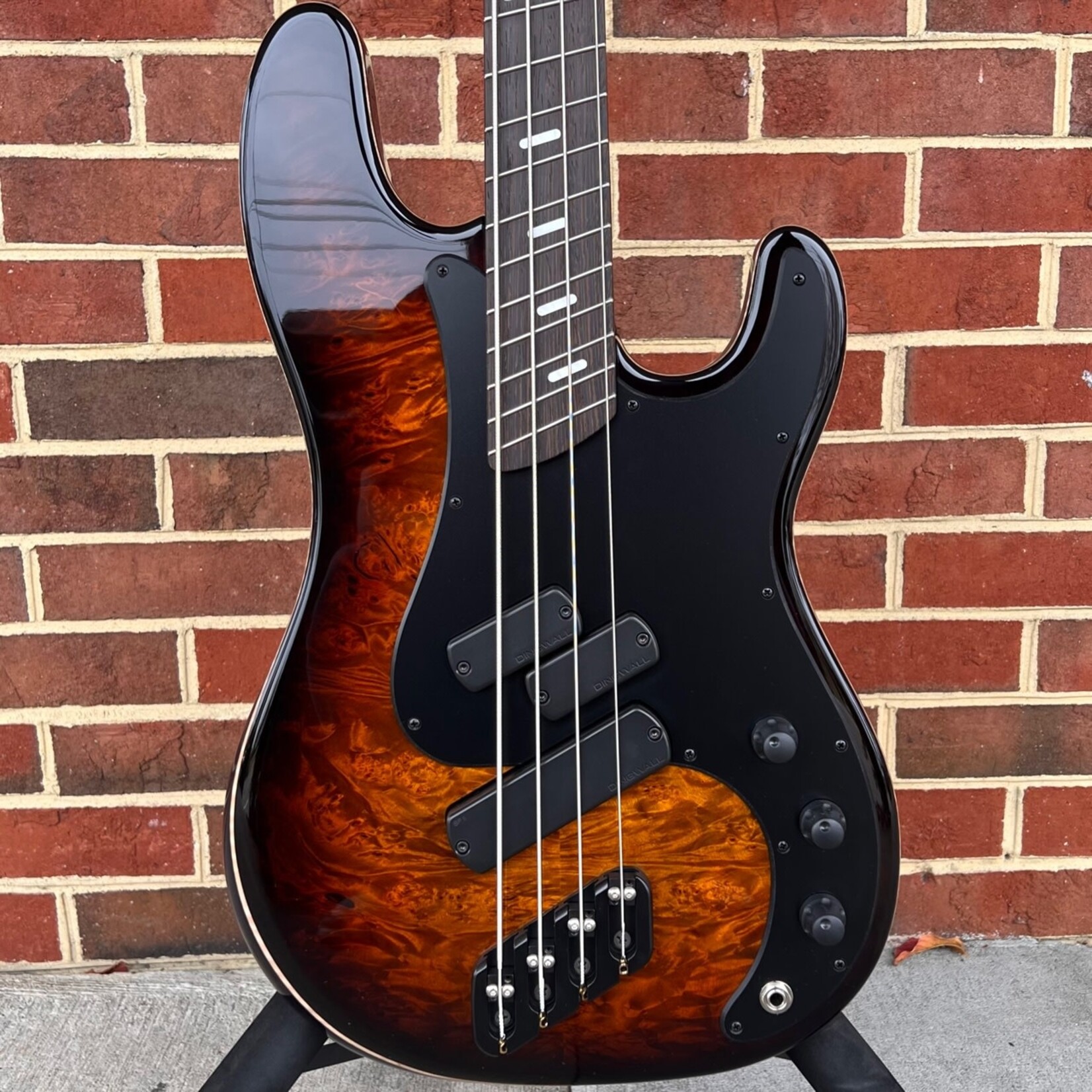Dingwall Dingwall Super PJ Custom 4-String, Tiger Eye Burst, Maple Burl X-Top, Ash Body - Trans Black, Matte Black Pickguard, Dual P & Super Fatty II Pickups, Wenge Neck & Fretboard, Dunlop Flush Mount Strap Locks, Dingwall Deluxe Gig Bag