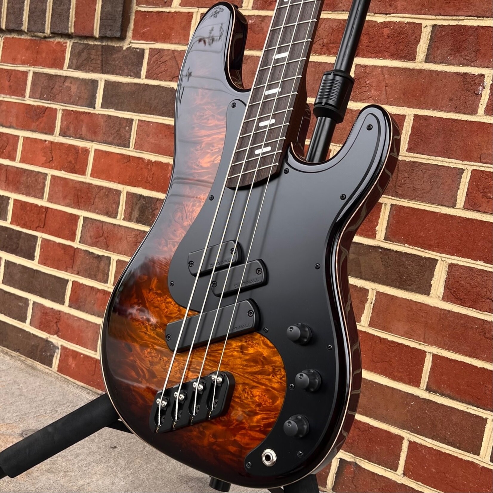 Dingwall Dingwall Super PJ Custom 4-String, Tiger Eye Burst, Maple Burl X-Top, Ash Body - Trans Black, Matte Black Pickguard, Dual P & Super Fatty II Pickups, Wenge Neck & Fretboard, Dunlop Flush Mount Strap Locks, Dingwall Deluxe Gig Bag