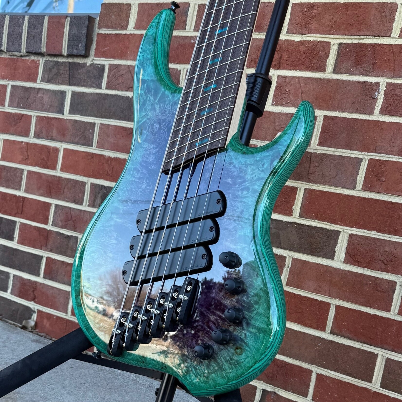 Dingwall Dingwall Z3 6-String, Purple to Turquoise Reverseburst, Maple Burl X-Top, Swamp Ash Body, 5pc Maple Neck, Wenge Fretboard, Colored Pearloid Speedo Bar Inlays, Super Fatty II Pickups, Neve Preamp w/ Master Tone Control, Dingwall Deluxe Gig Bag (USED)