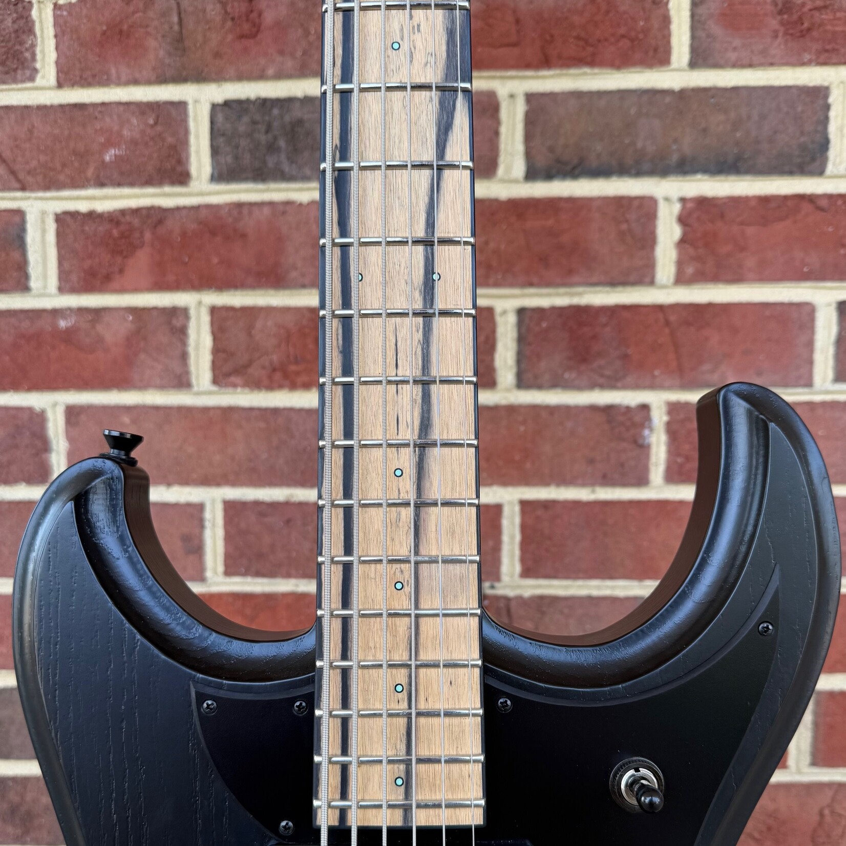 Dunable Guitars Dunable Gnarwhal VI, 30.75" Scale, Black Satin, Swamp Ash Body, Maple Neck, Pale Moon Ebony Fretboard, Black Binding, Luminlay Dot Inlays, Hipshot Tone A Matic Bridge, Graph Tech Ratio Tuners, Hardshell Case