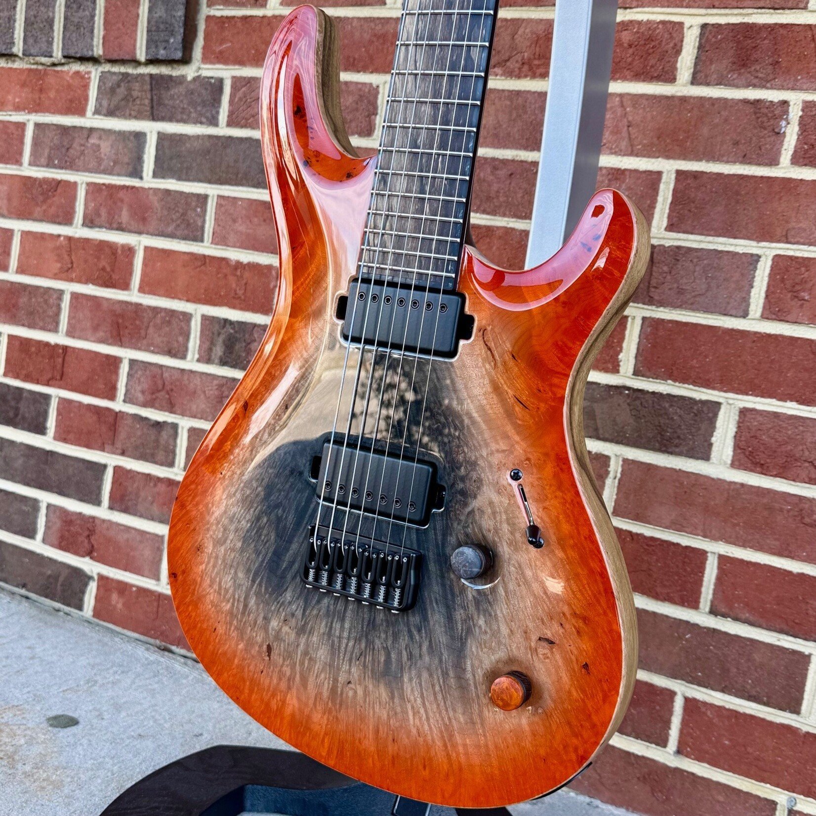 Mayones Mayones Regius Core 7 B27, Supernova Orange, 4A Burl Maple Top, Black Limba Body, 4A Pale Moon Ebony Fretboard, Matching Wood Knobs, Velvetrone Pickups, Mayones Deluxe Hybrid Case