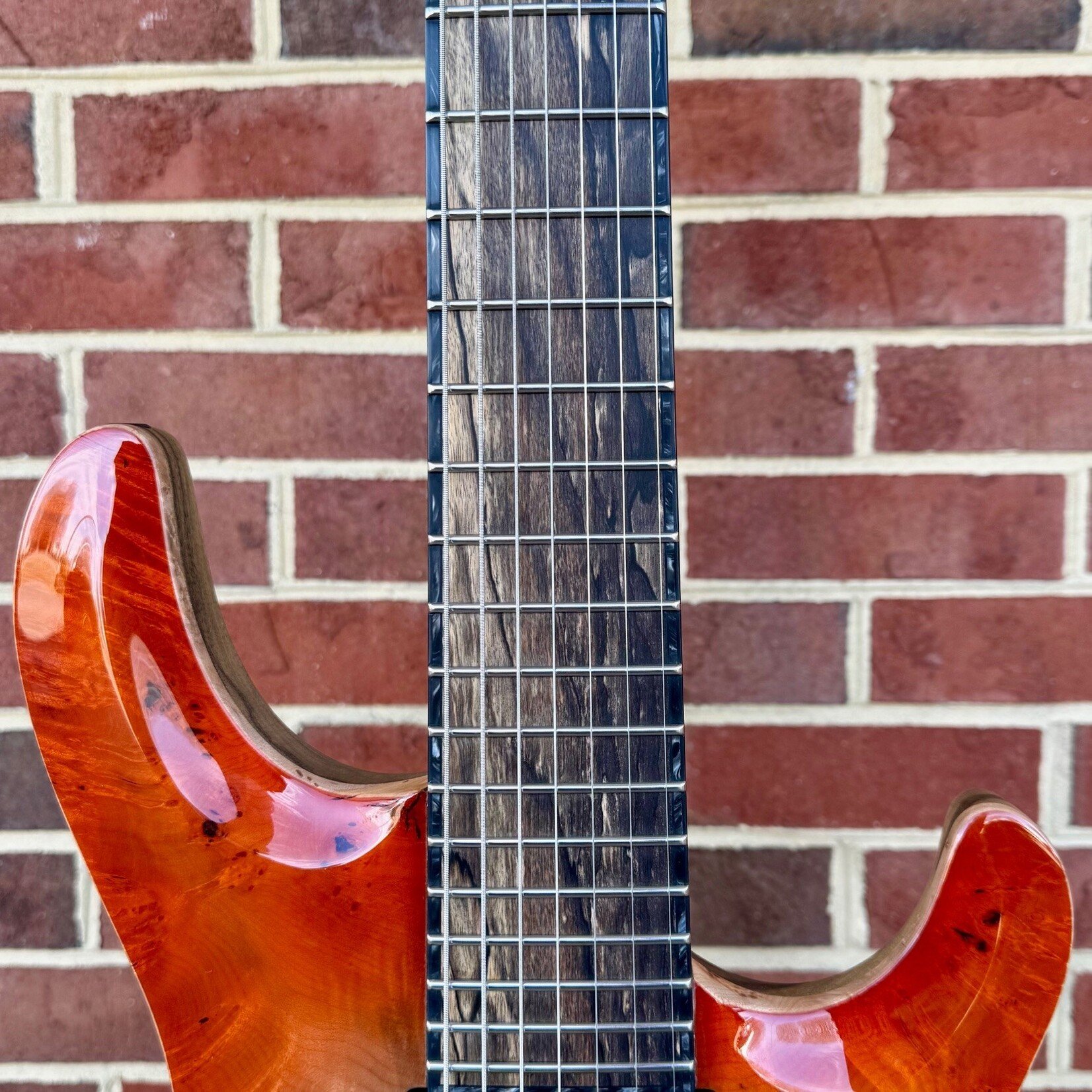 Mayones Mayones Regius Core 7 B27, Supernova Orange, 4A Burl Maple Top, Black Limba Body, 4A Pale Moon Ebony Fretboard, Matching Wood Knobs, Velvetrone Pickups, Mayones Deluxe Hybrid Case